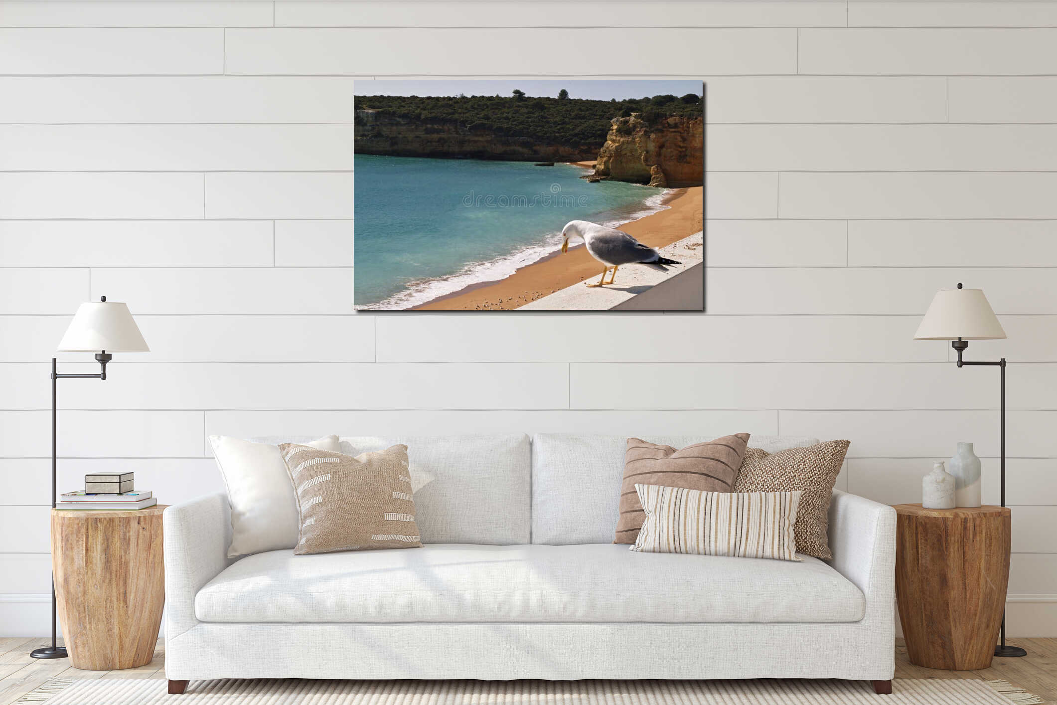 Seagull standing on wall overlooking Algarve beach interior mockup