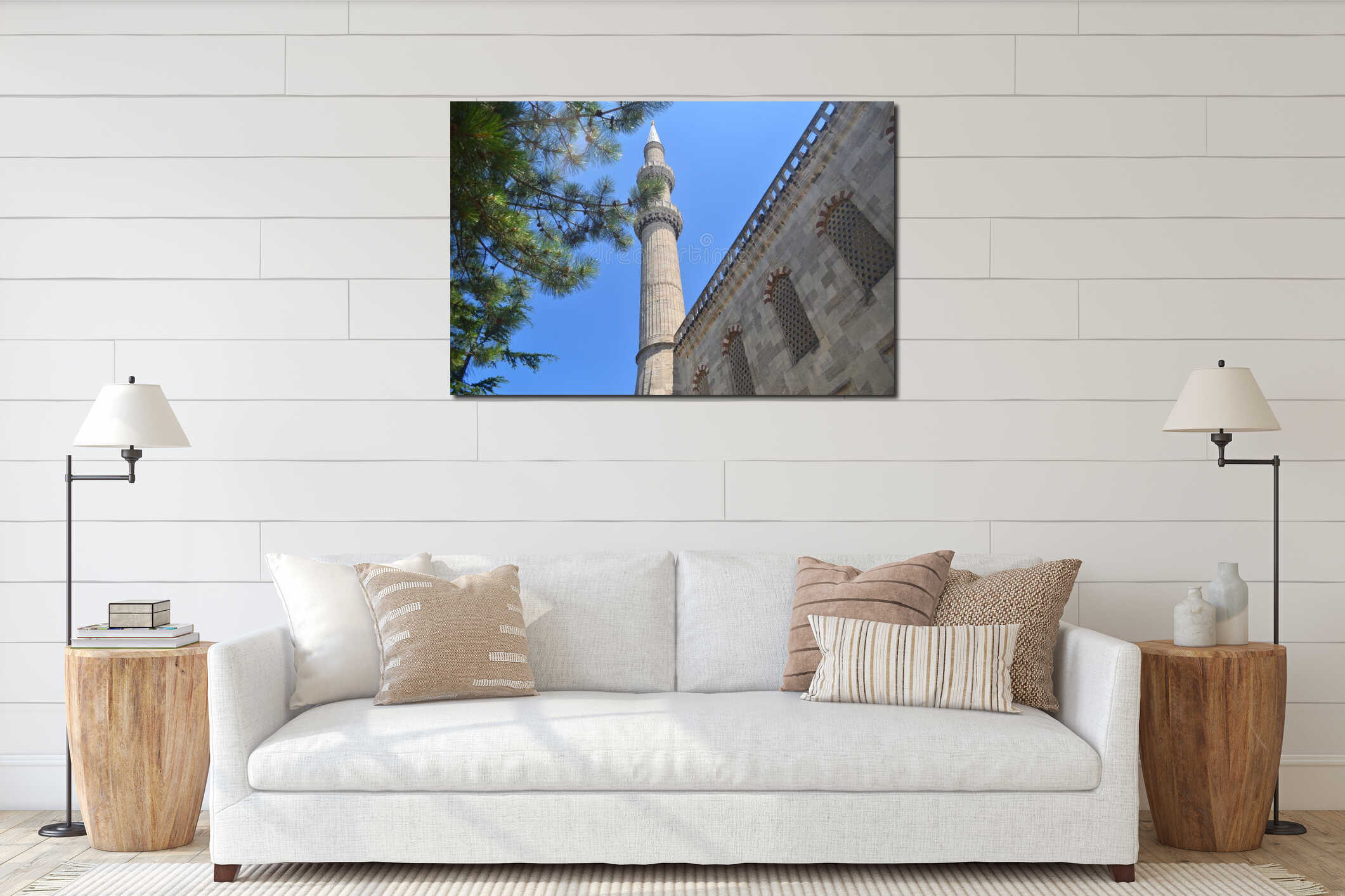 Majestic stone minaret of a classic mosque under a clear blue sky. interior mockup