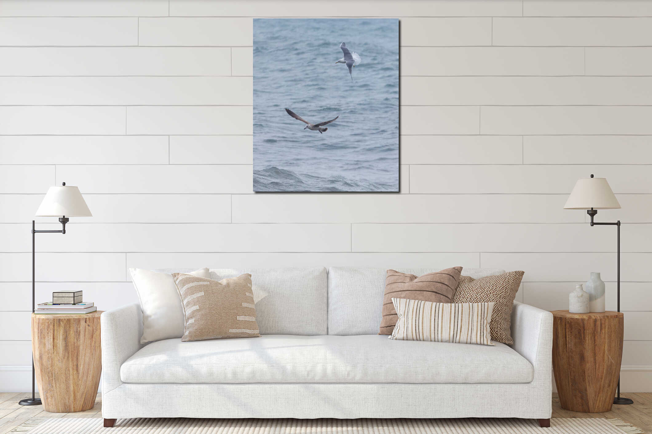 Two seagulls flying over the ocean interior mockup