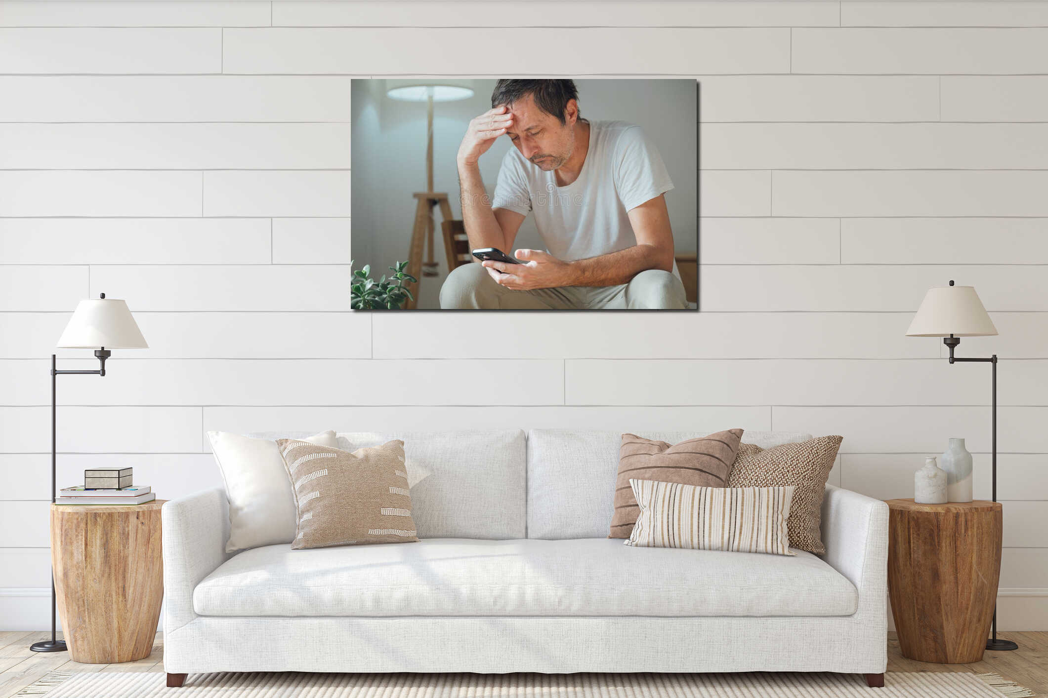 Laid-back mature man procrastinating and browsing social media on smartphone, lounging tired and bored in cozy living room chair interior mockup