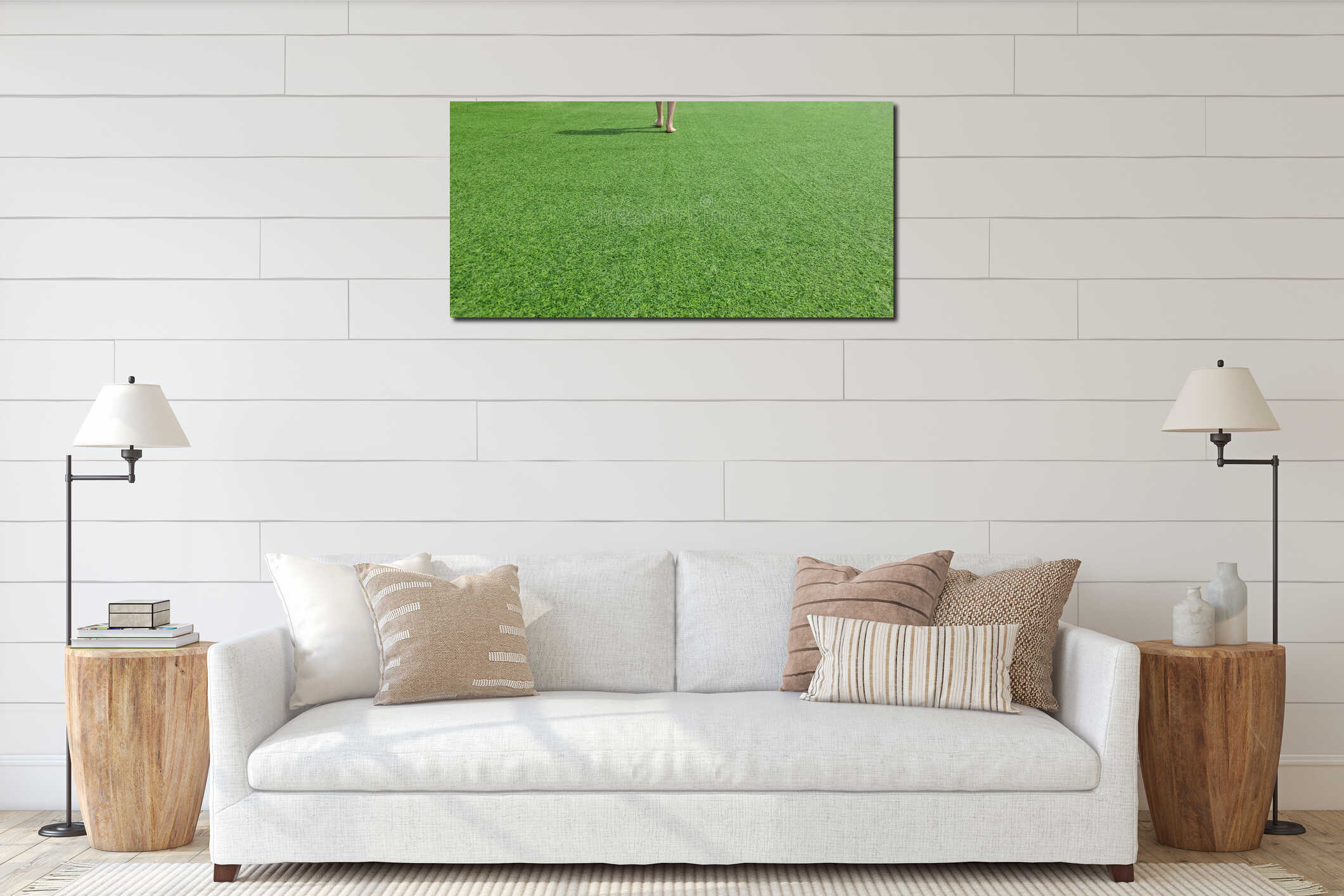 Person walks barefoot on green grass in a park during sunny day interior mockup