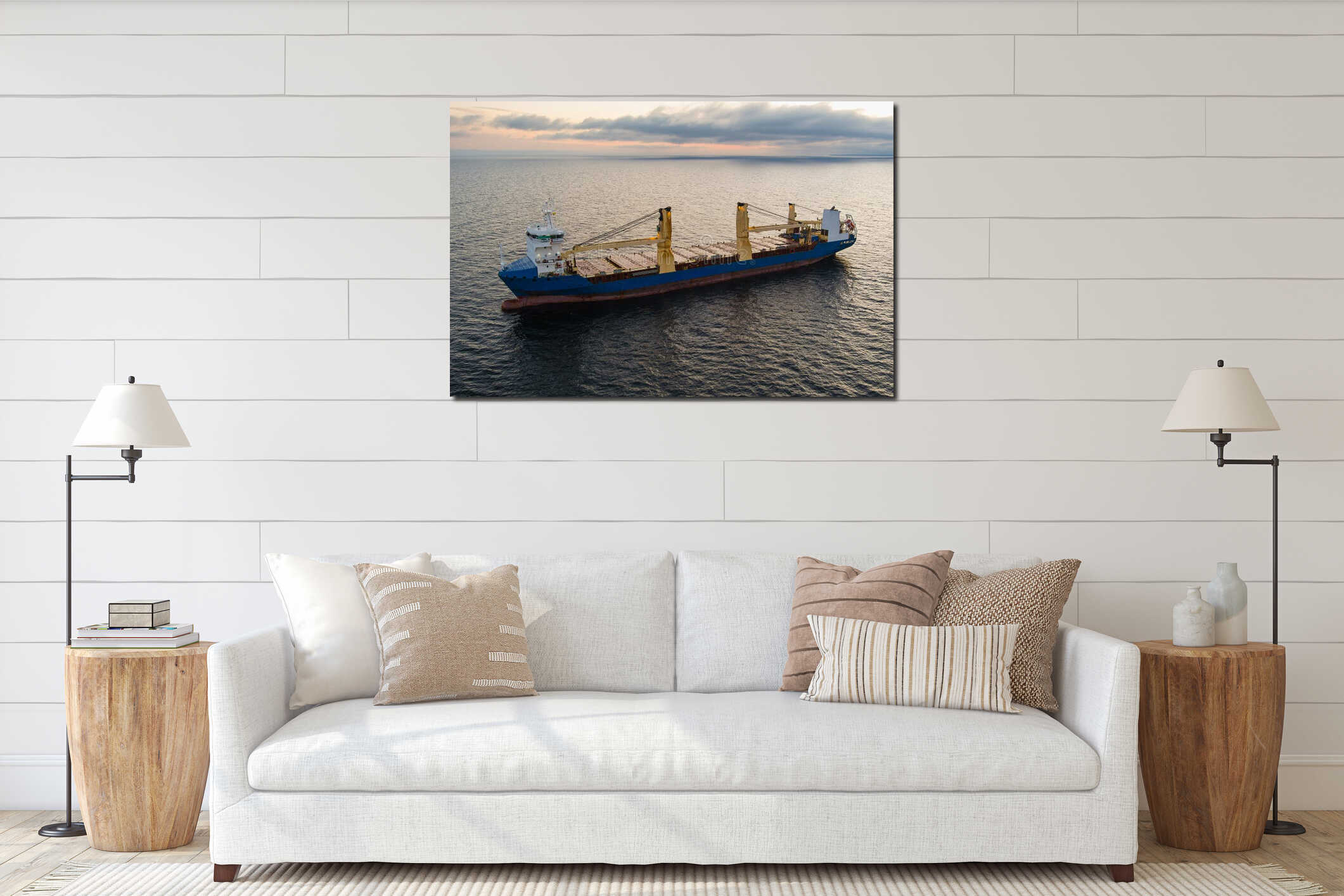 Aerial view of a large blue cargo ship anchored in the open waters of the Baltic Sea near the coast of Estonia at sunset or interior mockup