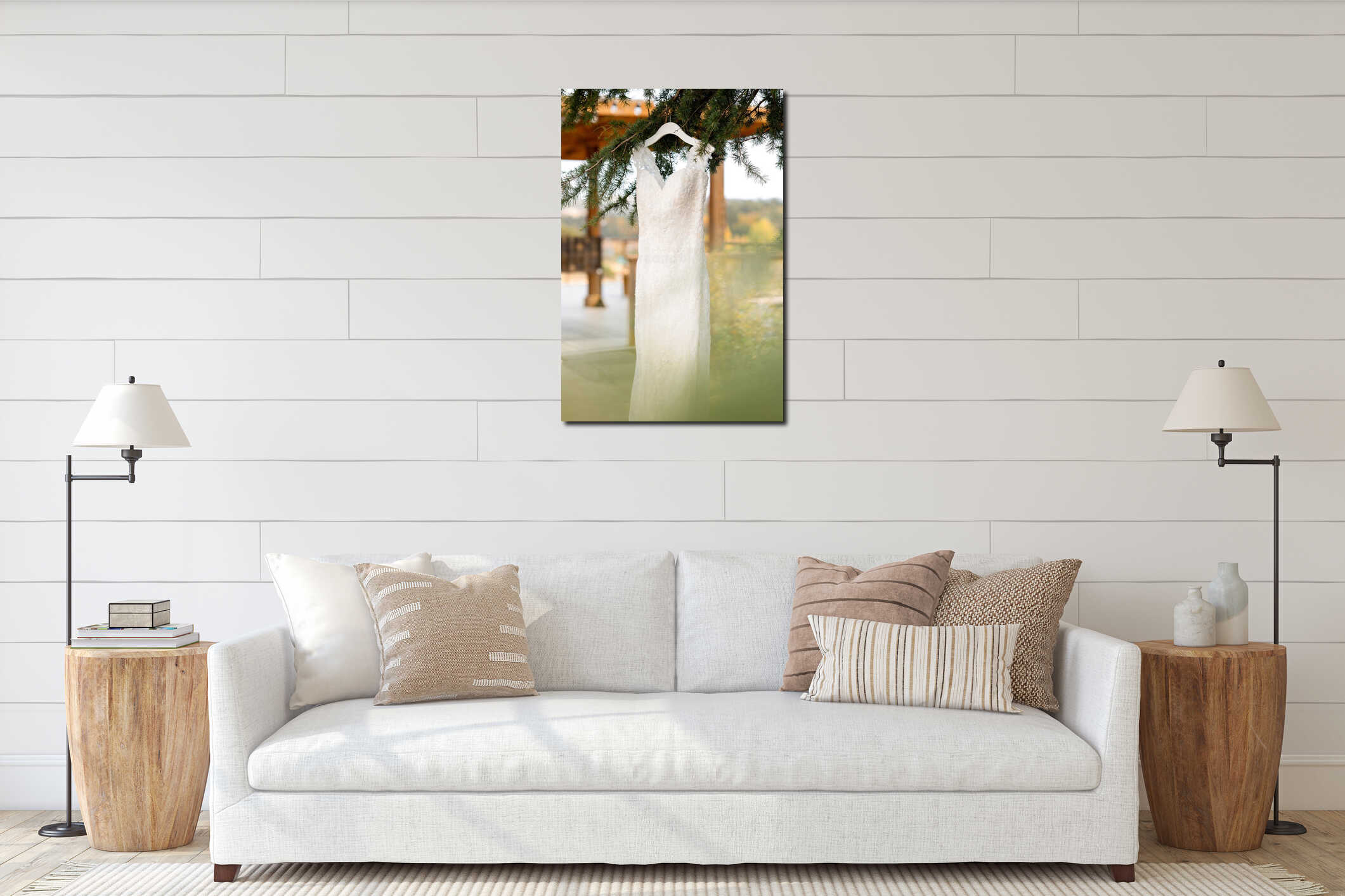 Elegant lace wedding dress hanging from a tree branch outdoors interior mockup