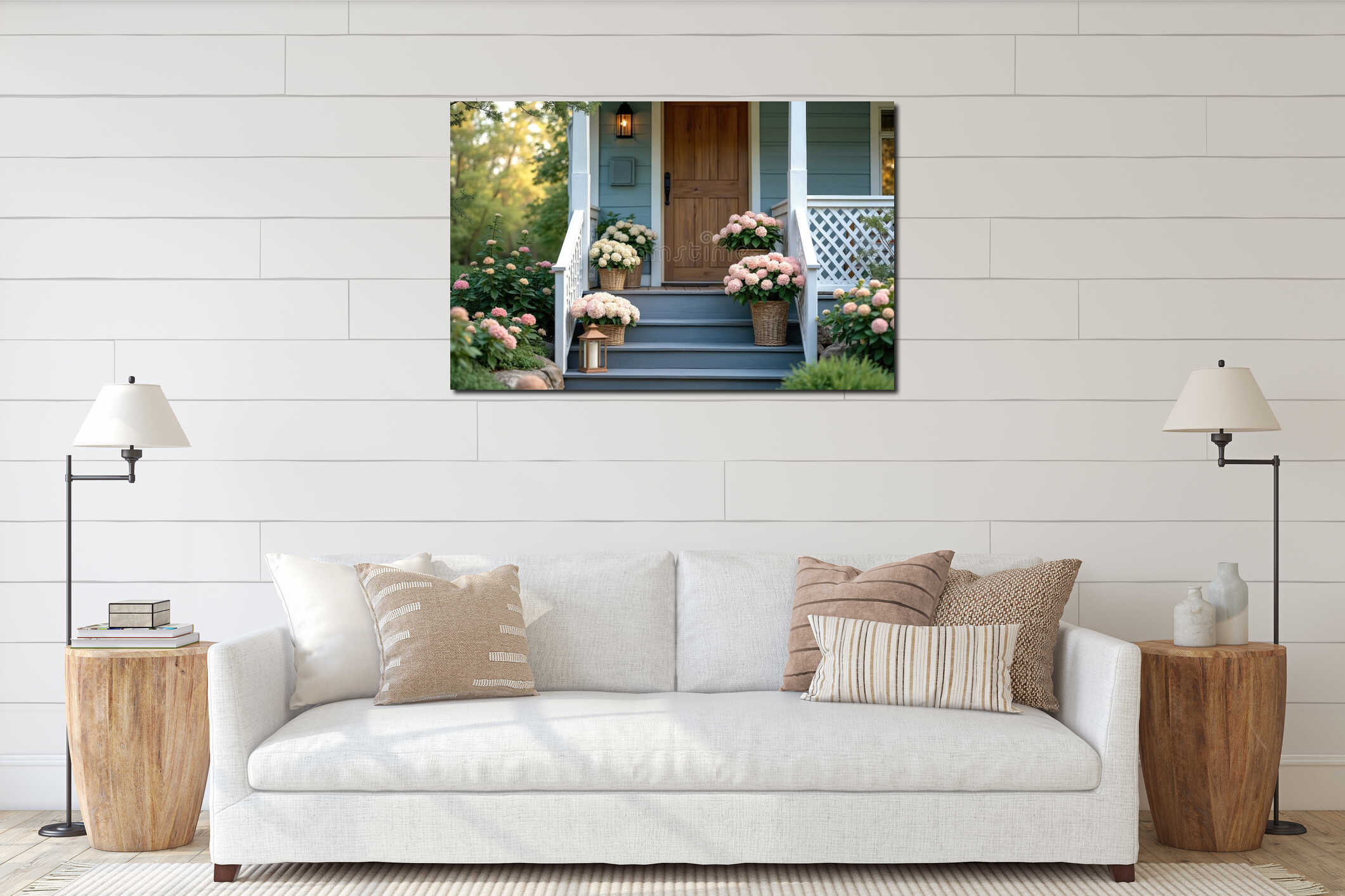 Blue house entrance with wooden door, grey steps, and white railing. Potted hydrangeas in pink and white adorn the porch. Rich interior mockup