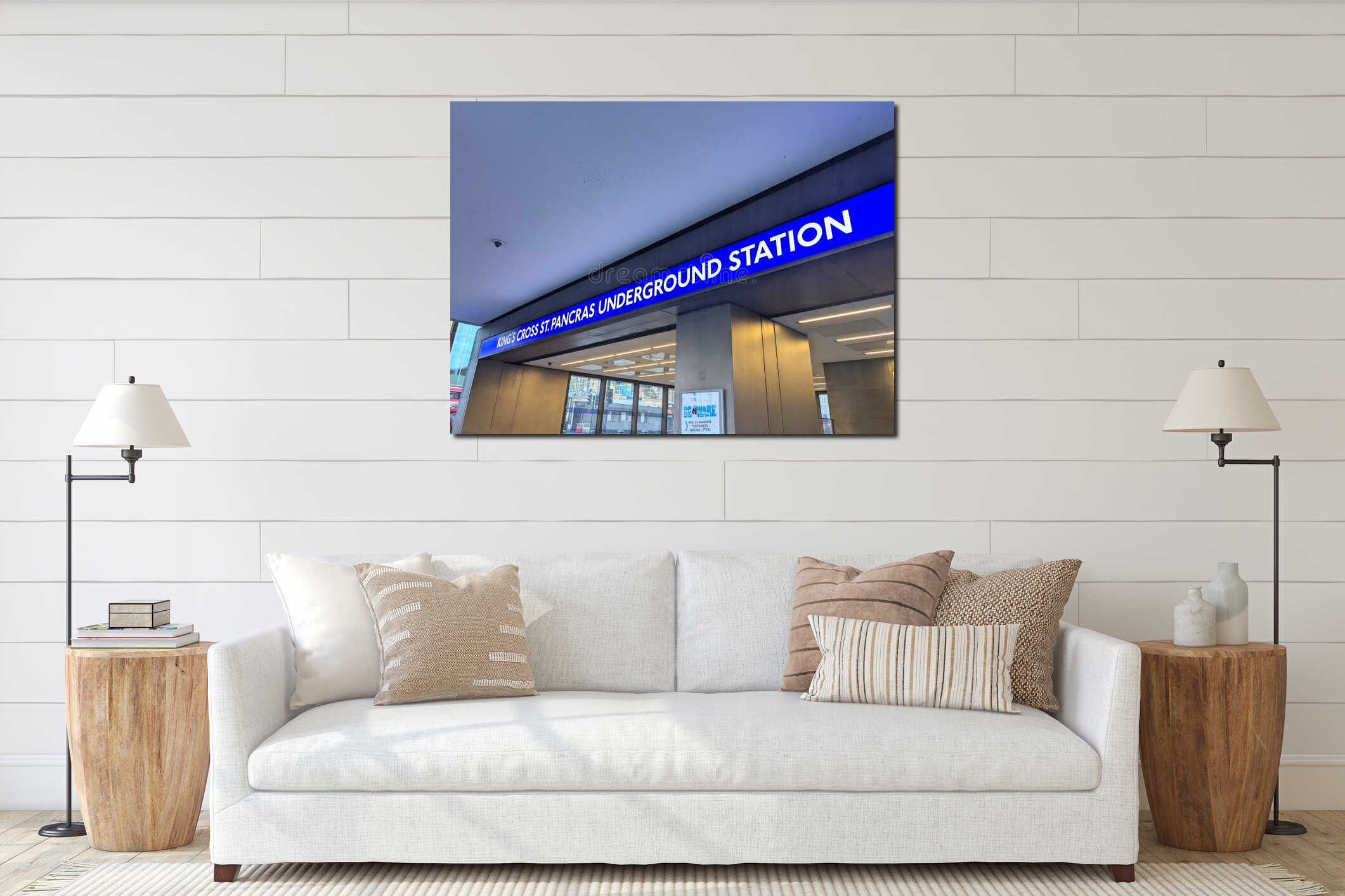 Iconic blue illuminated signage at the King's Cross St. Pancras Underground Station entrance interior mockup