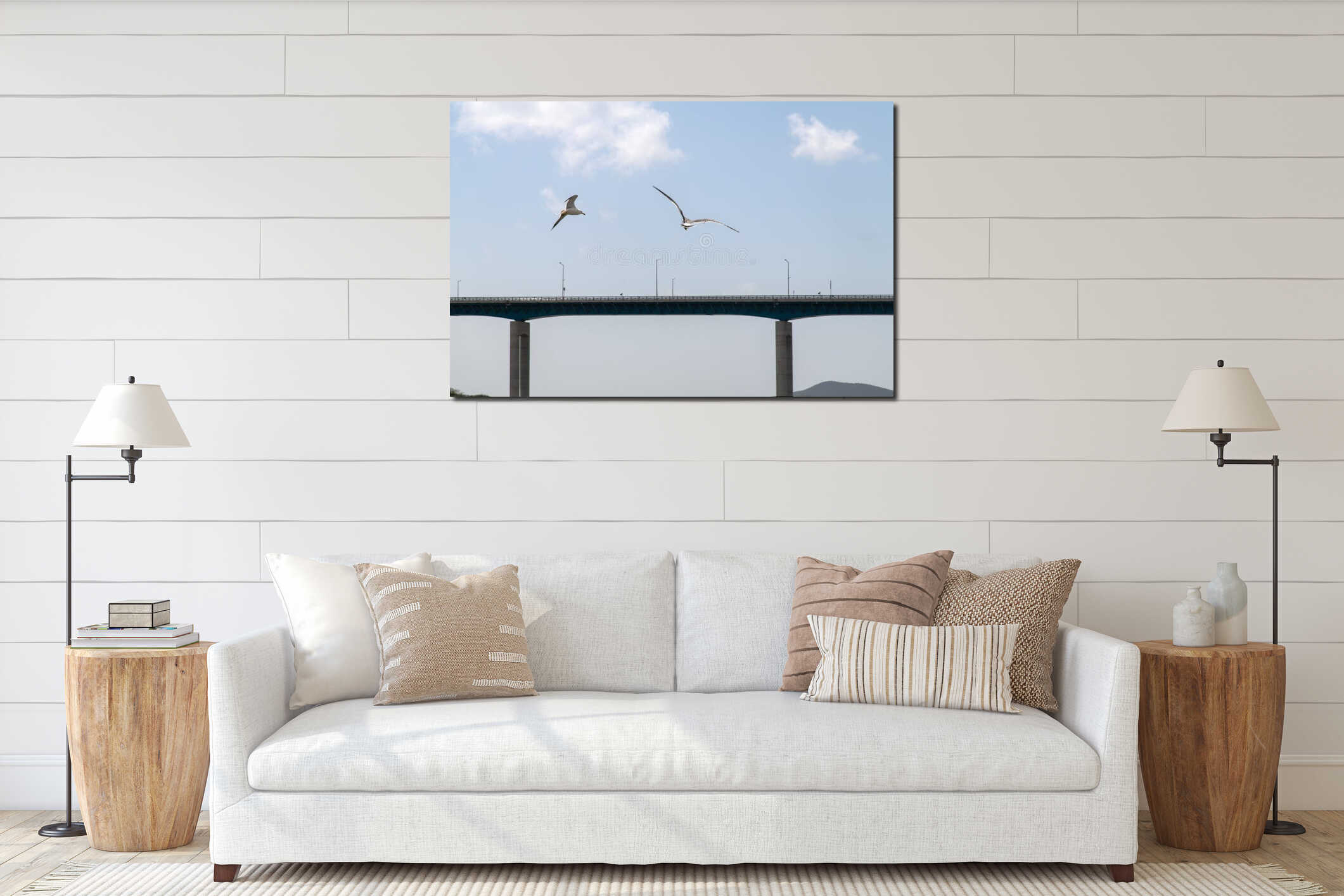 flying seagulls against a bridge on the sea interior mockup