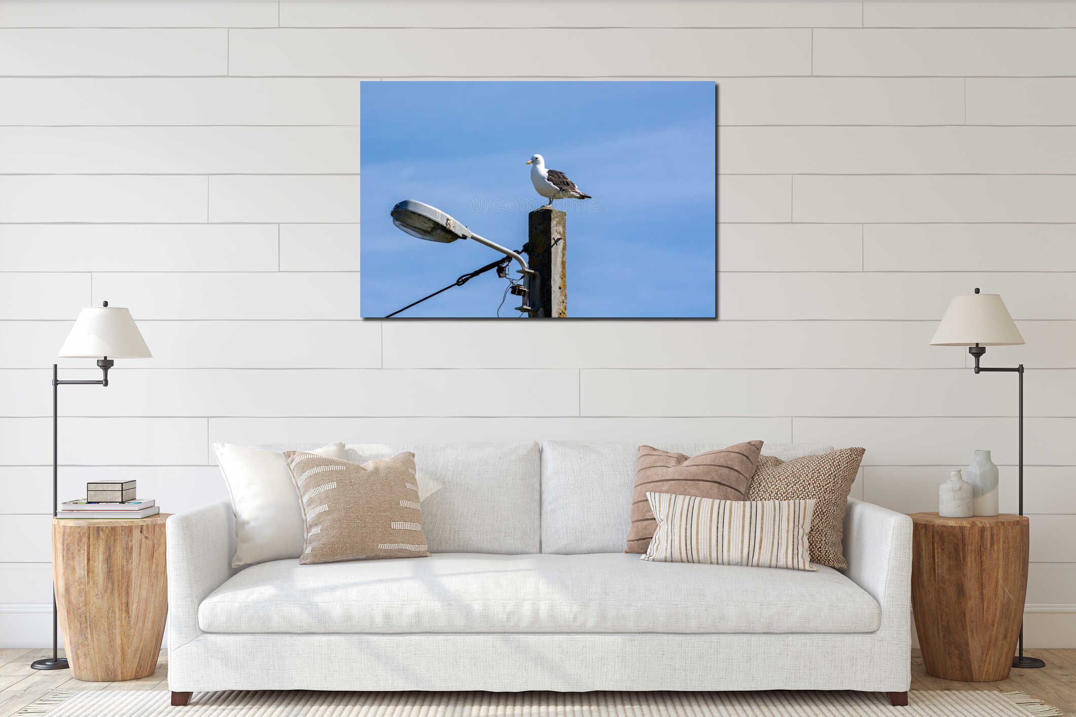 Seagull Perched on a Concrete Pole Against Blue Sky interior mockup