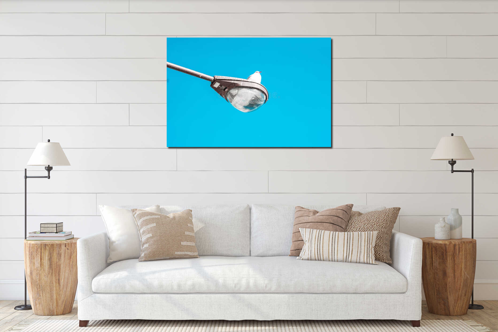 Seagull perched on a street lamp against a blue background interior mockup