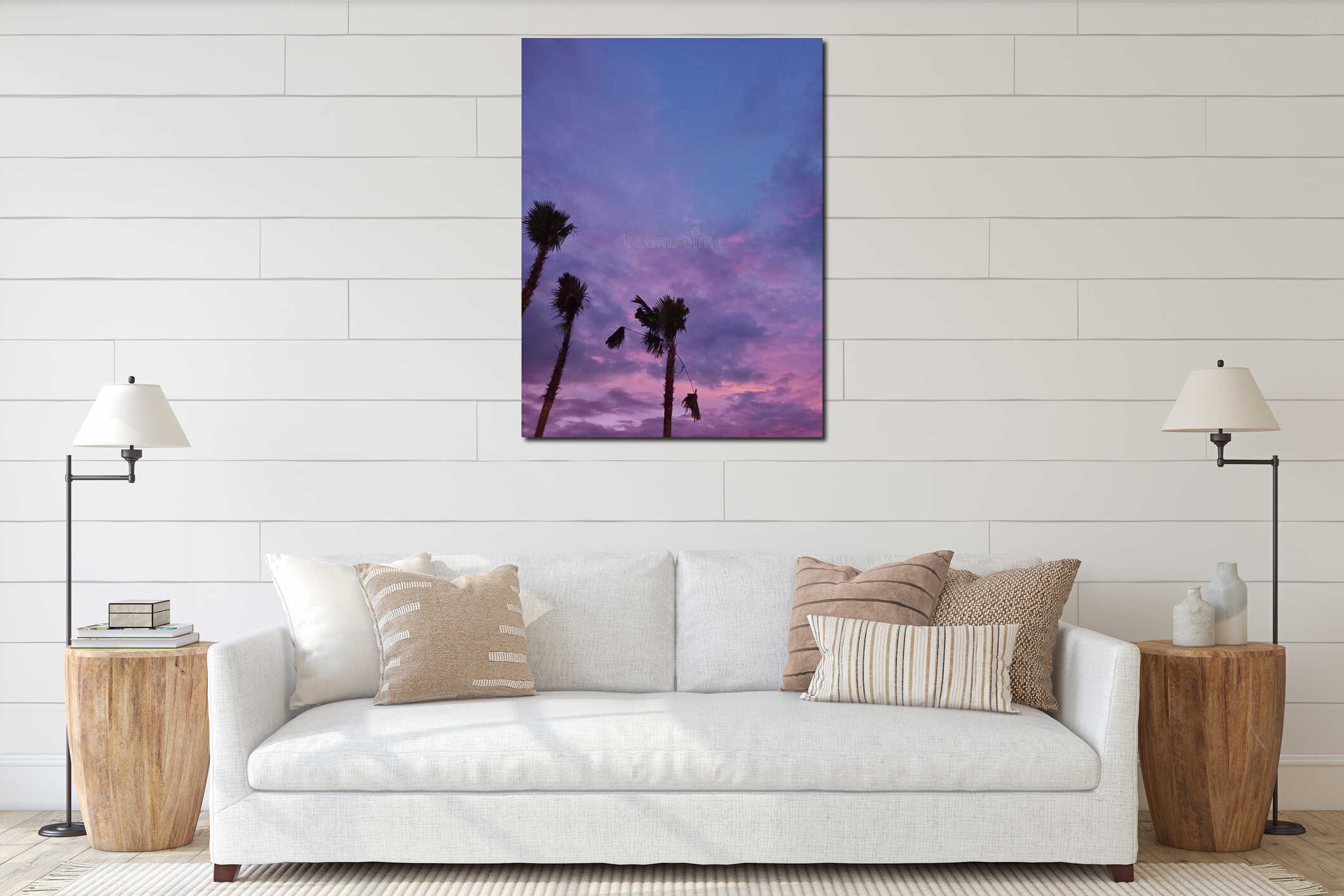 Dramatic nature background of a purple sunset with silhouettes of palm trees and urban buildings in the distance. interior mockup