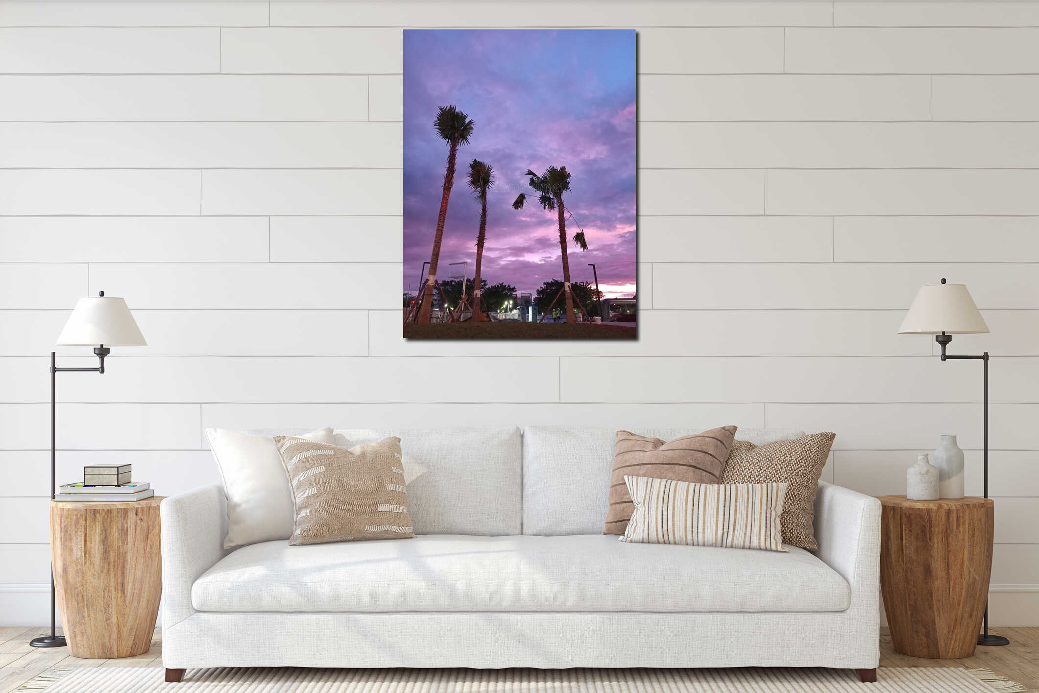 Tropical palm trees silhouettes under a dramatic purple and pink sunset sky in an urban city park at twilight. interior mockup