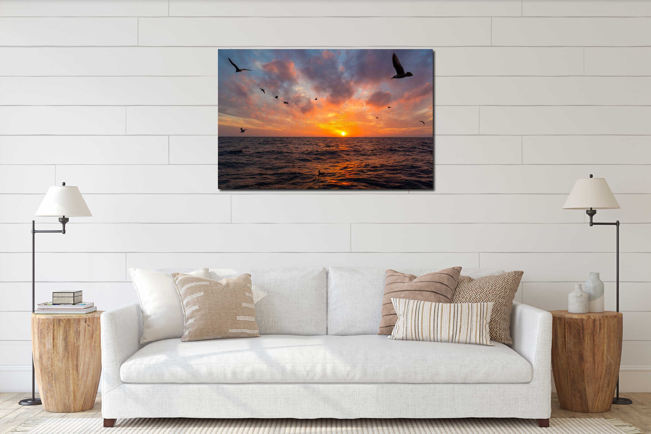 Seagulls flying over the ocean at sunset interior mockup
