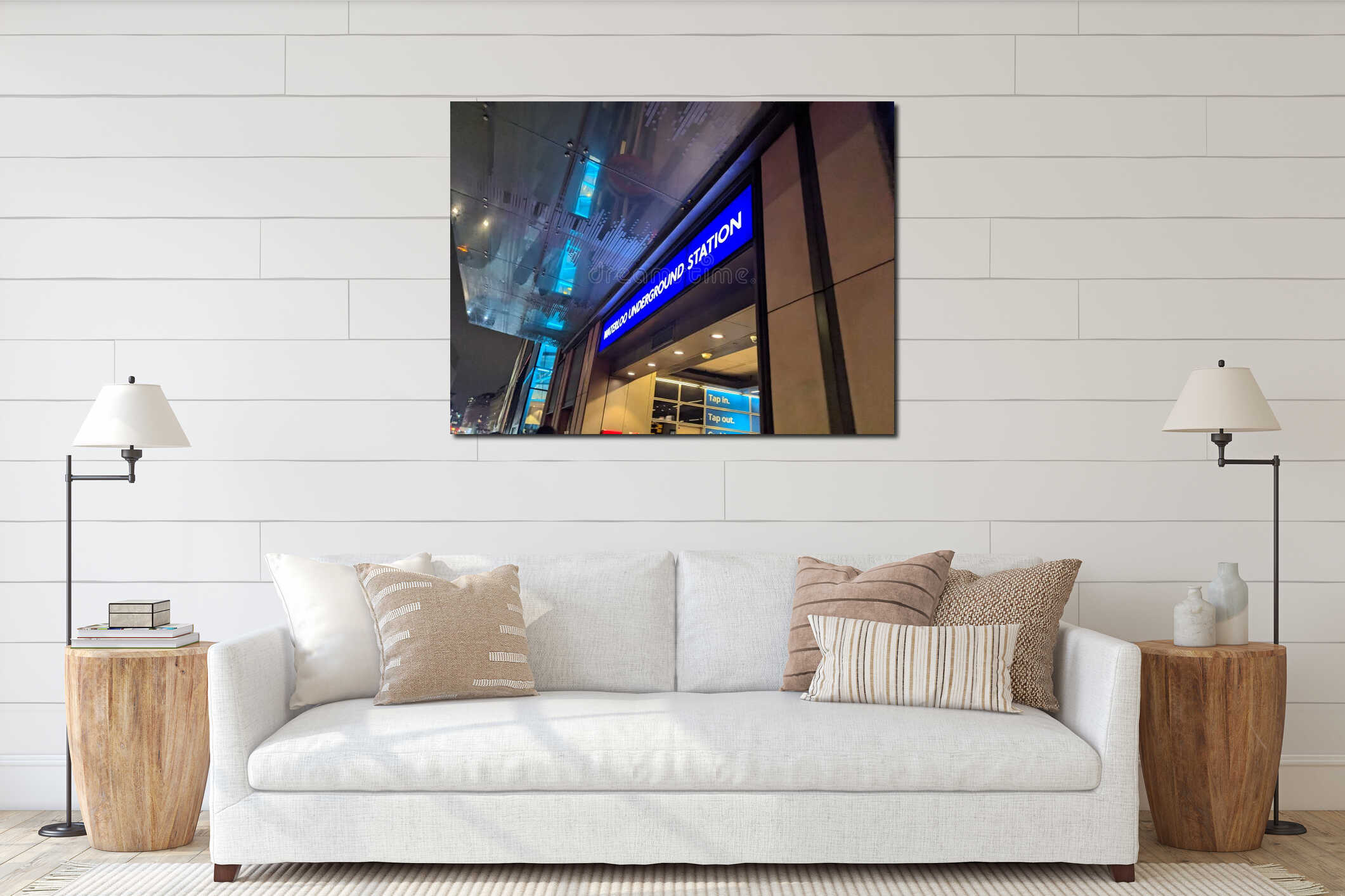 Illuminated blue sign at the glass entrance of Waterloo Underground Station in London at night interior mockup