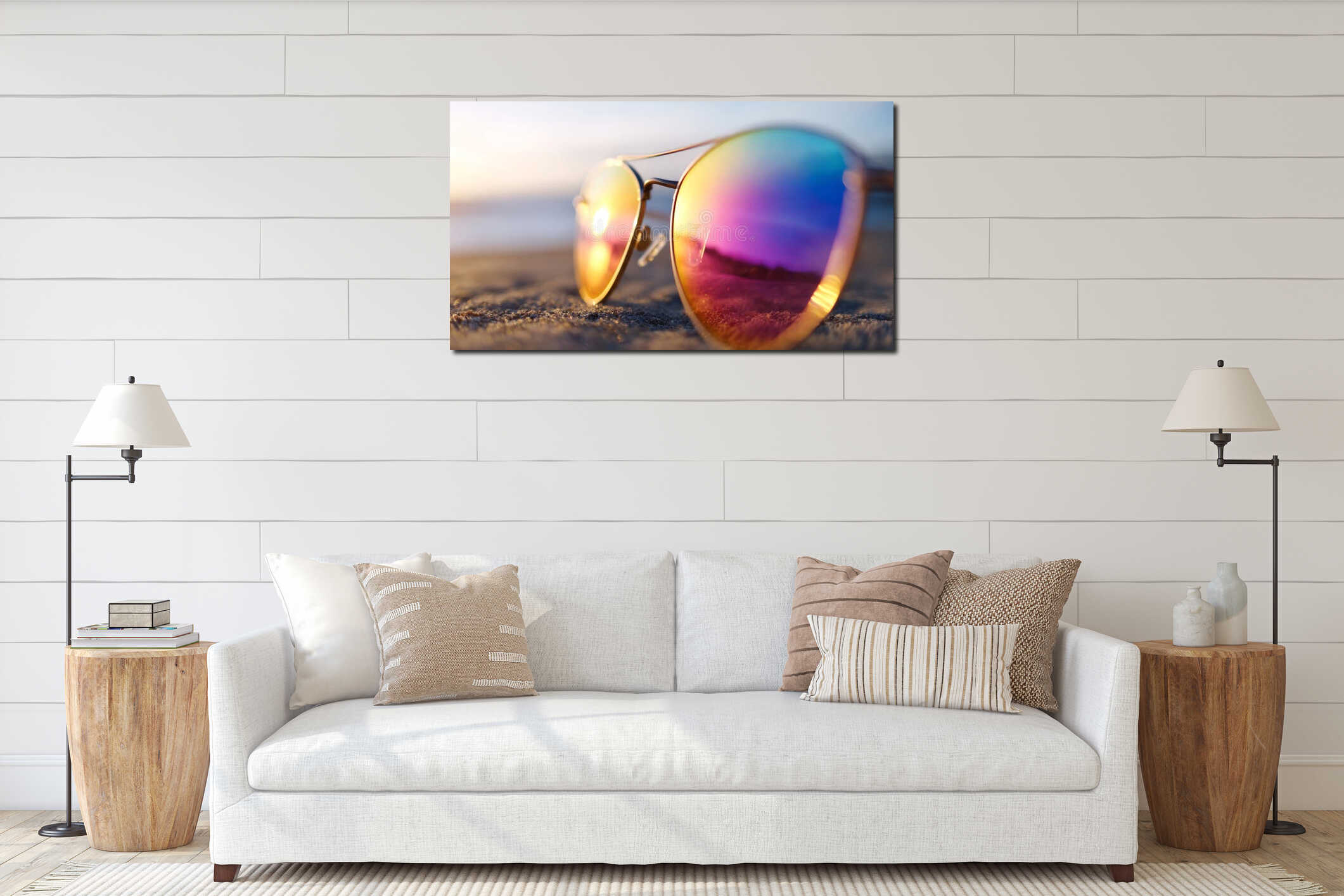 A pair of sunglasses sitting on top of a sandy beach interior mockup