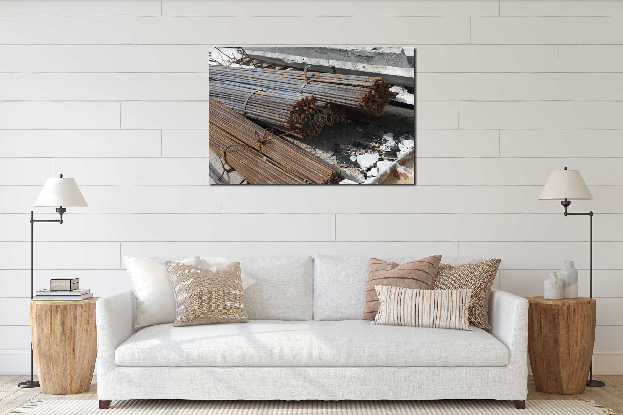 Steel rebar bundles are stacked on construction site, surrounded by concrete debris and materials. rebar is rusted, indicating interior mockup