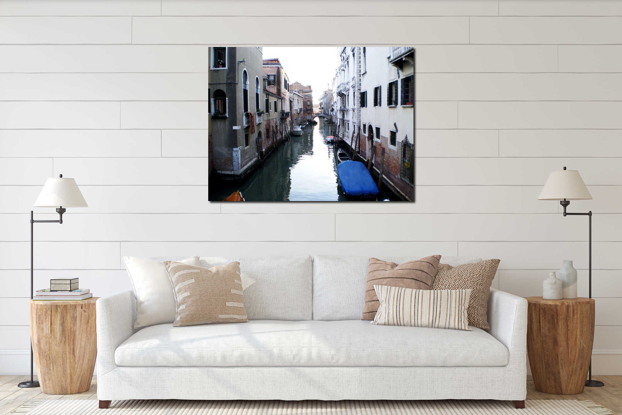A serene gondola glides through the narrow canals of Venice, surrounded by centuries-old palaces, graceful bridges, and softly interior mockup