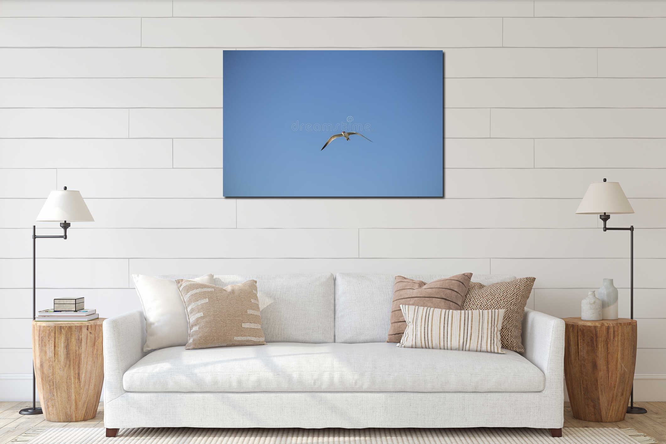 Single seagull flying in clear blue sky. Concept of freedom, solitude, inner peace, independence, and calm mindfulness. interior mockup