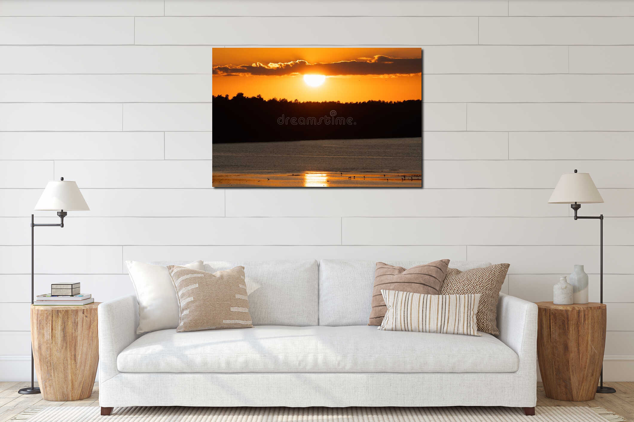 Beautiful golden sunset over the calm Baltic Sea coast in Estonia with birds silhouettes on the shore and forest background interior mockup