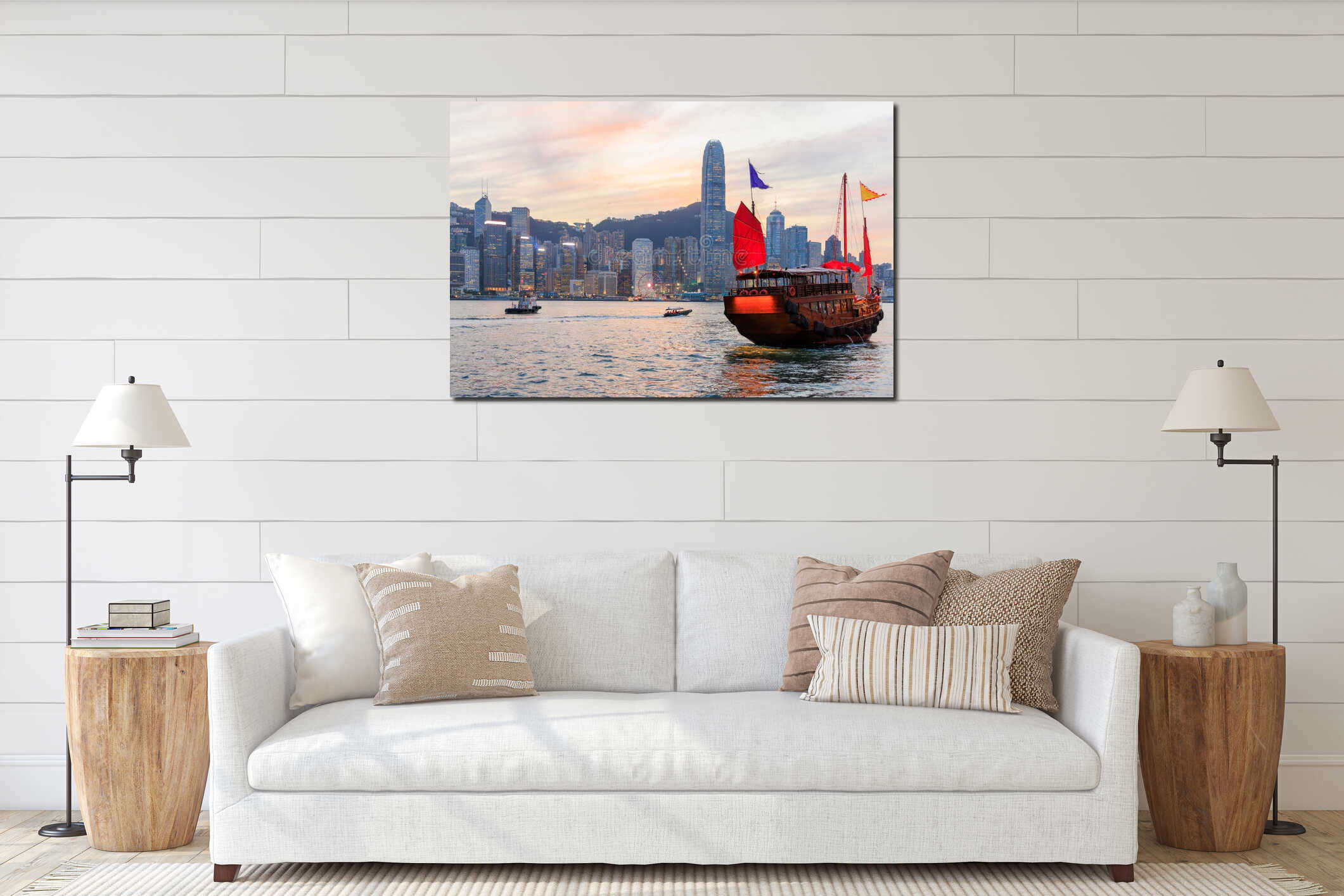 Traditional wooden junk boat with red sails against Hong Kong skyline during sunset interior mockup