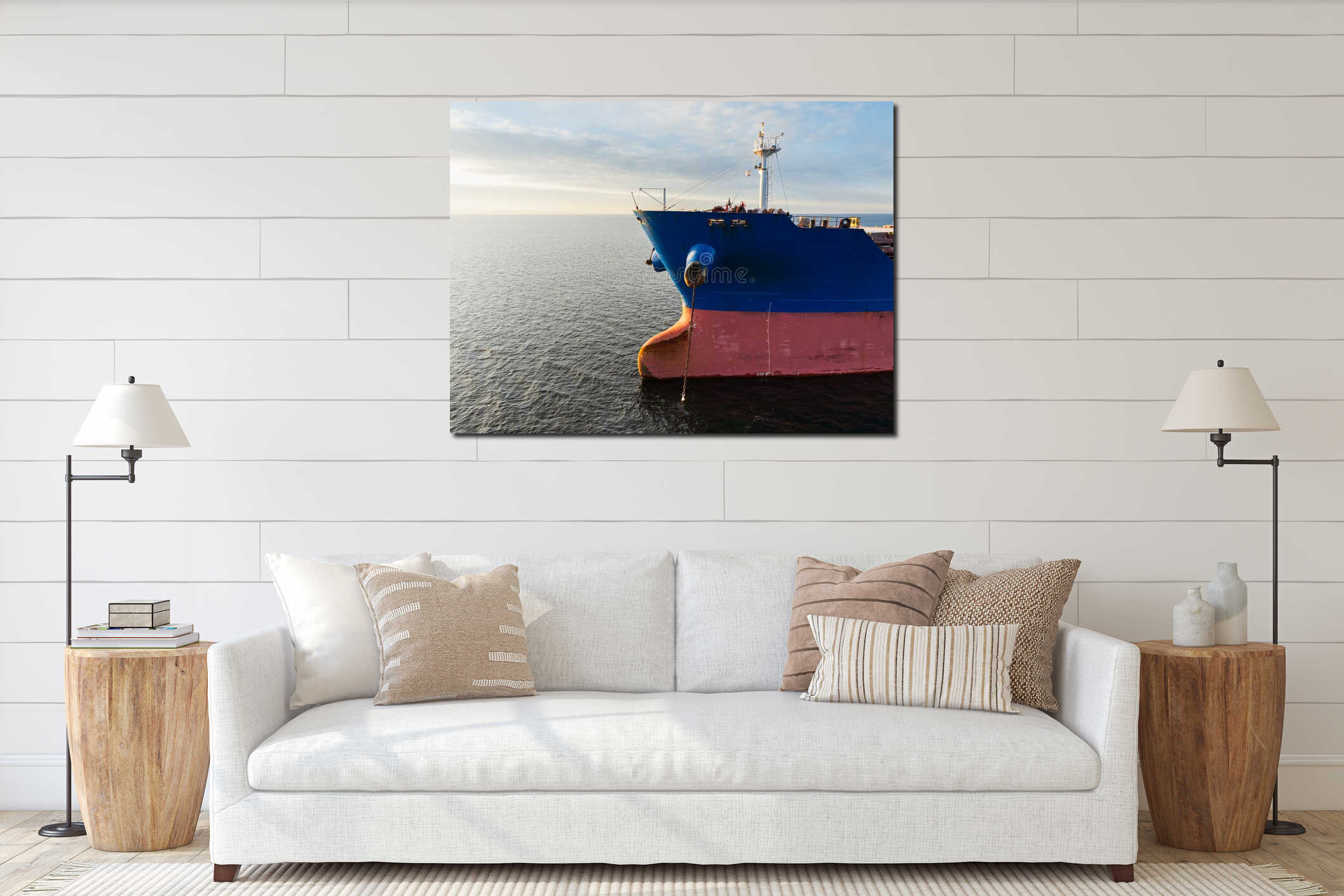High angle drone view of a large industrial cargo ship anchored in the calm blue waters of the Baltic Sea interior mockup