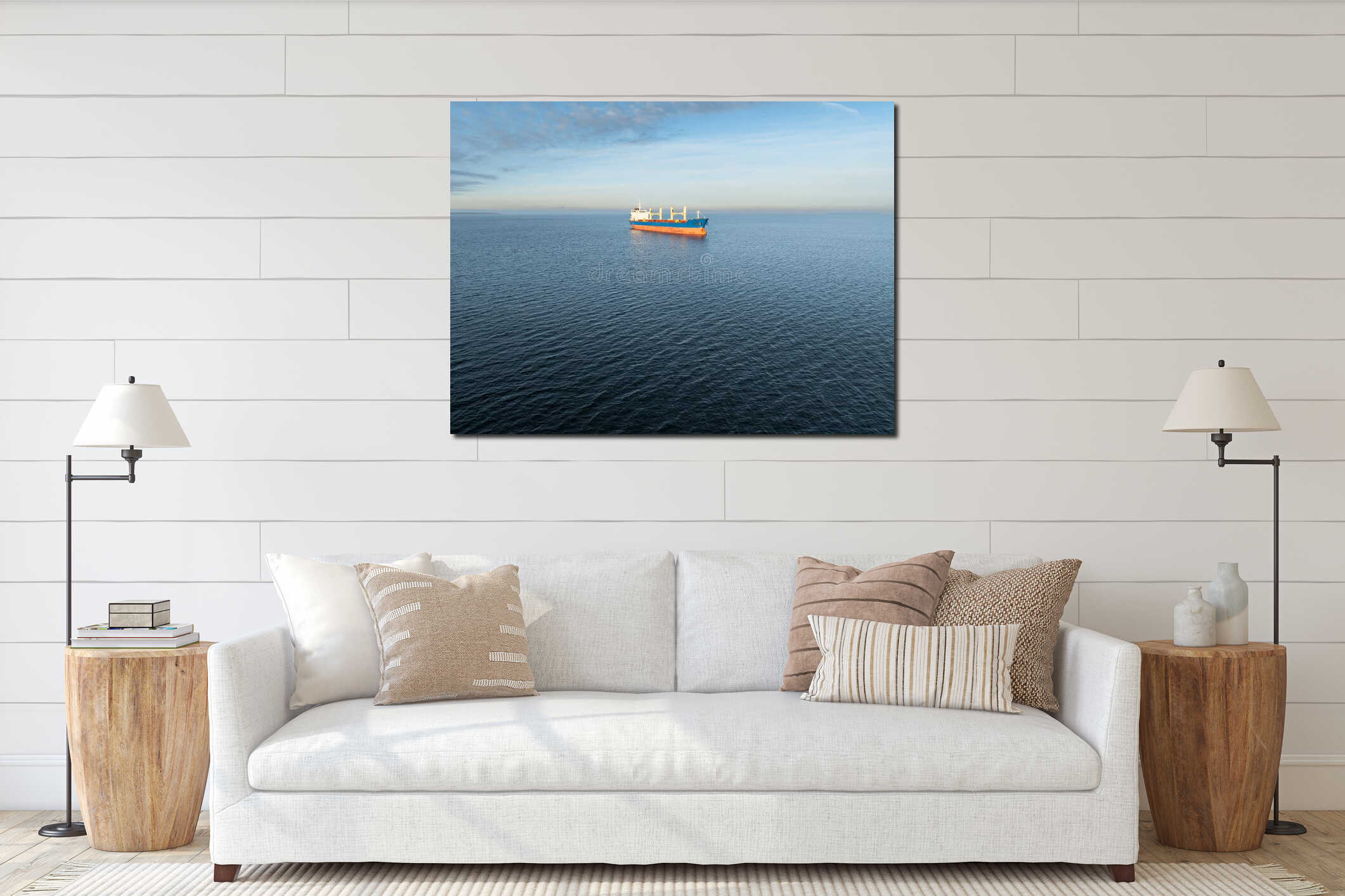 Scenic wide angle drone shot of a large industrial cargo ship floating on the calm blue waters of Baltic Sea interior mockup