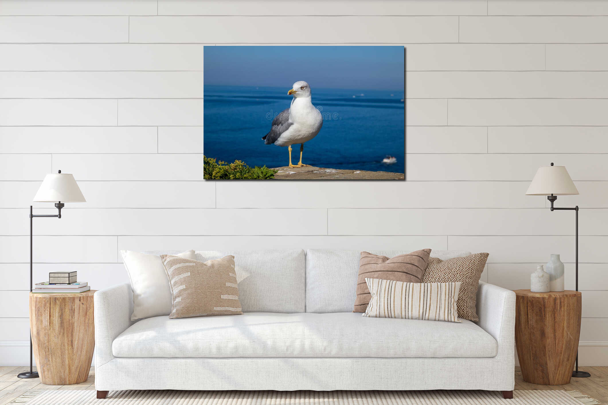 The seagull is standing on the rock interior mockup