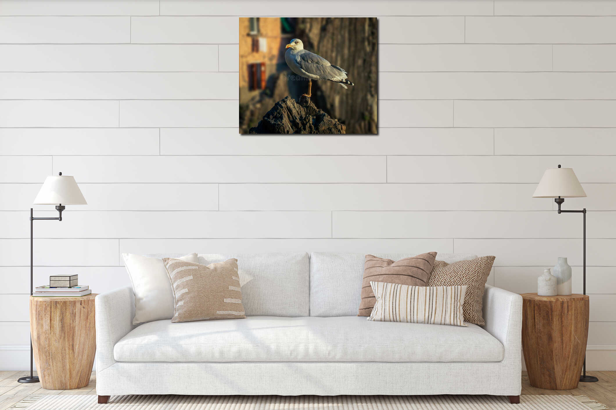 The seagull is standing on the rock interior mockup