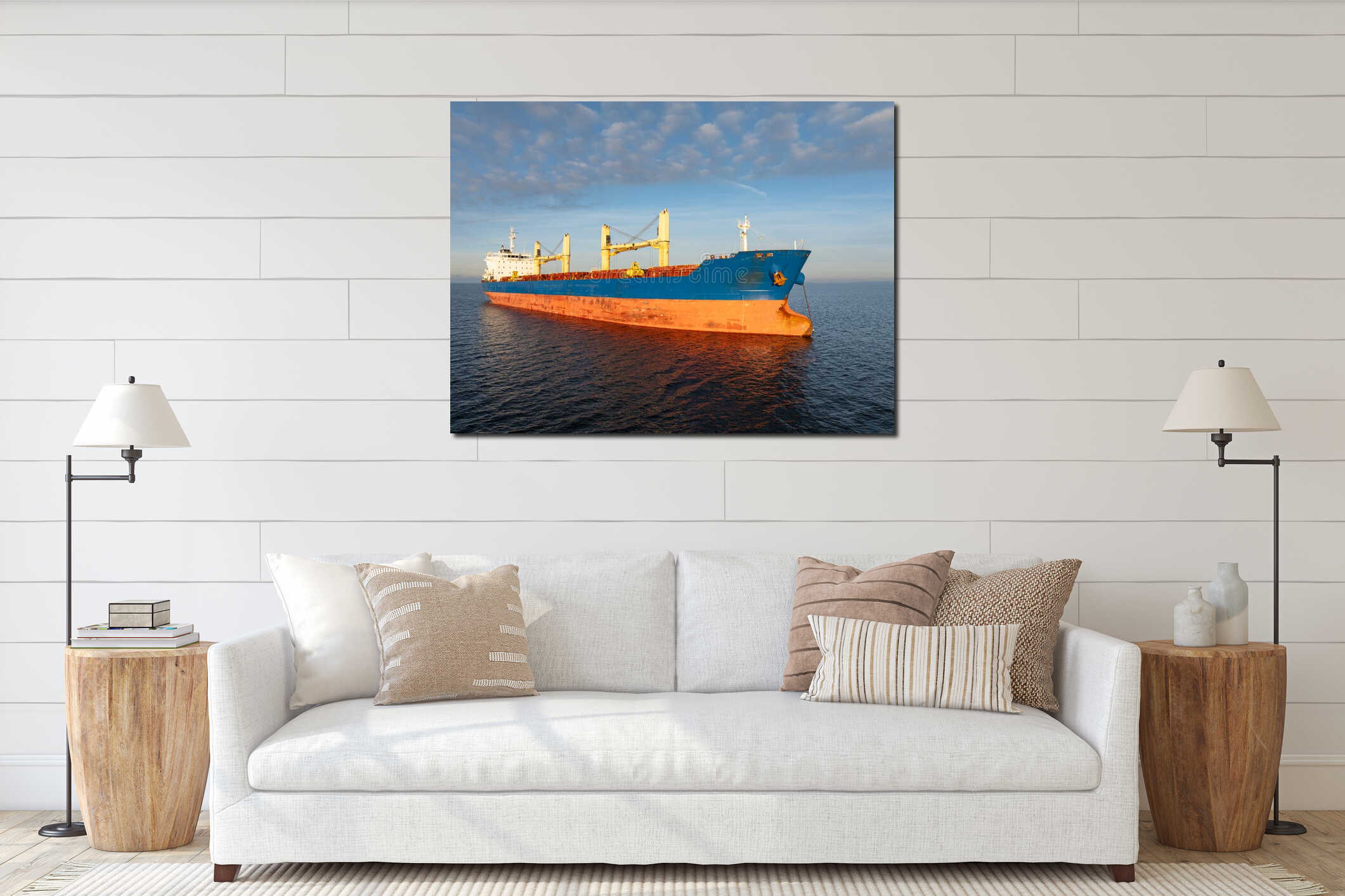 High angle drone view of a large bulk carrier cargo ship sailing across the blue Baltic Sea at sunset light interior mockup