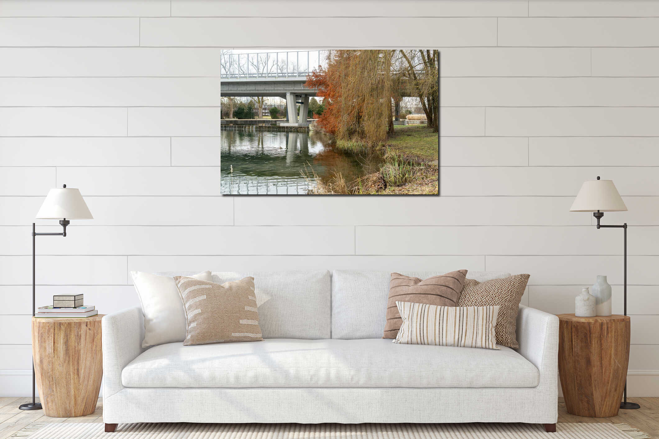Modern concrete bridge spans peaceful park water featuring ducks swimming near winter trees on an overcast day interior mockup