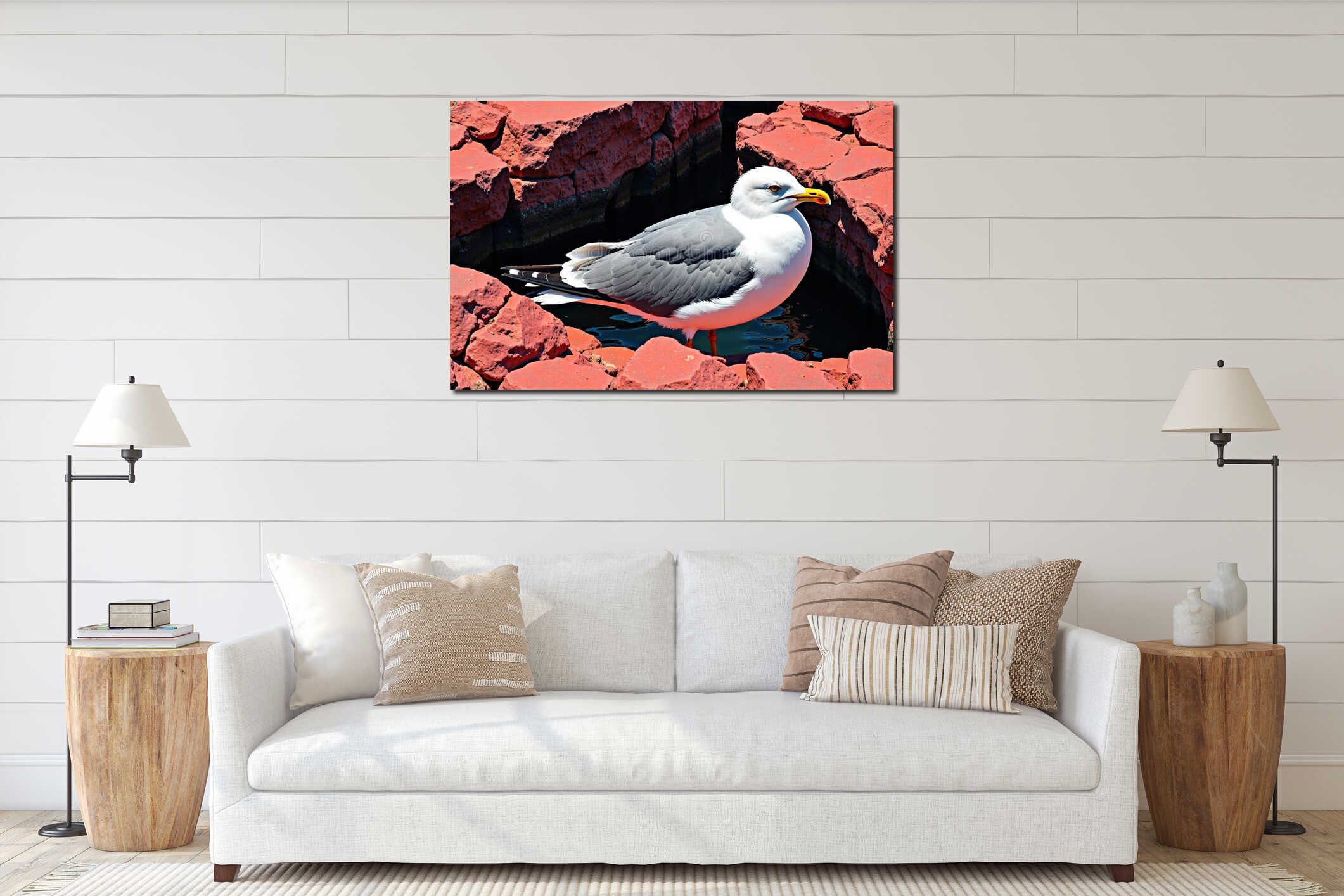 Seagull resting on red volcanic rocks beside calm tidal pool water with yellow beak interior mockup
