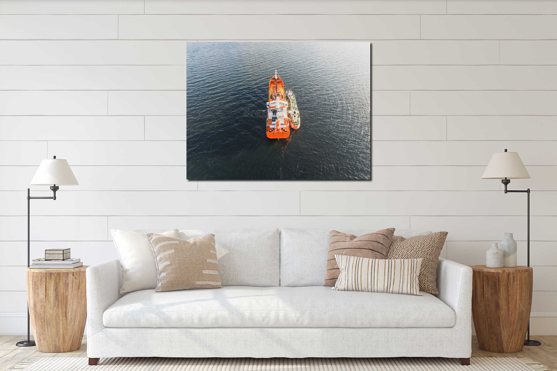 High angle drone view of a large orange tanker being refueled by a bunker barge ship in the open sea interior mockup