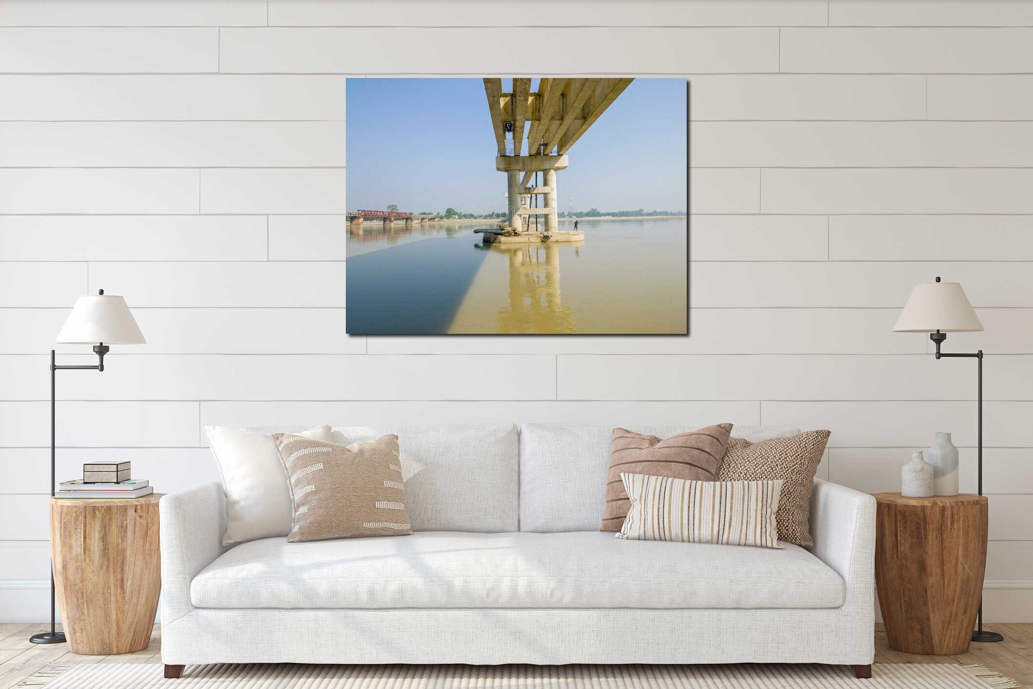 A large concrete bridge pillar standing in a body of water on a sunny day interior mockup