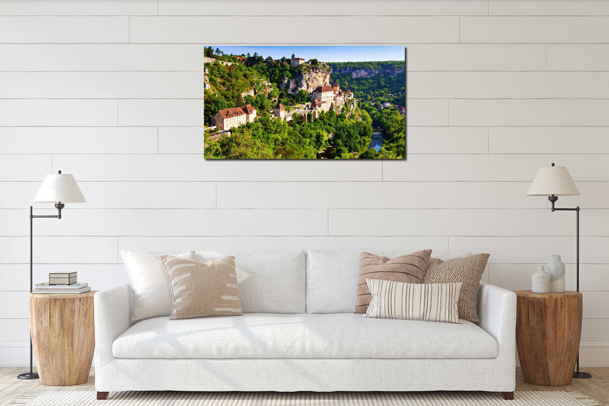 Scenic view of a historic village perched on a cliffside with lush greenery and river below. interior mockup