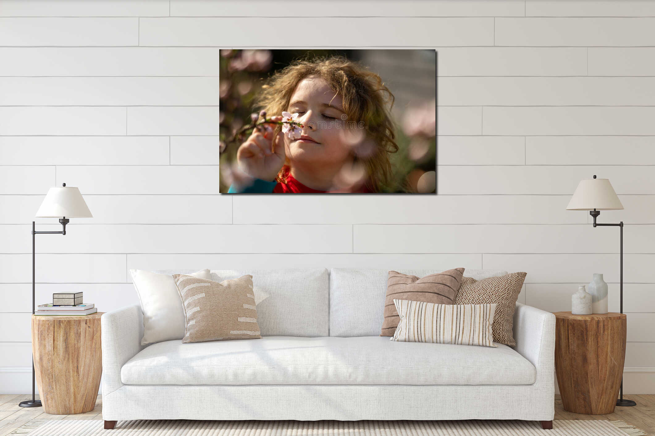 Child face close-up in spring park. Child enjoying spring sunshine. Child smelling flowers spring sunny day. Portrait of kid in interior mockup