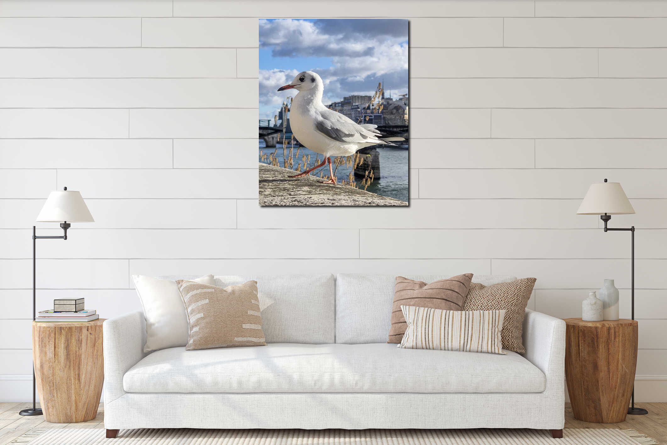 A seagull perched on the banks of the Seine River with the Parisian cityscape in the background on a clear winter day. interior mockup