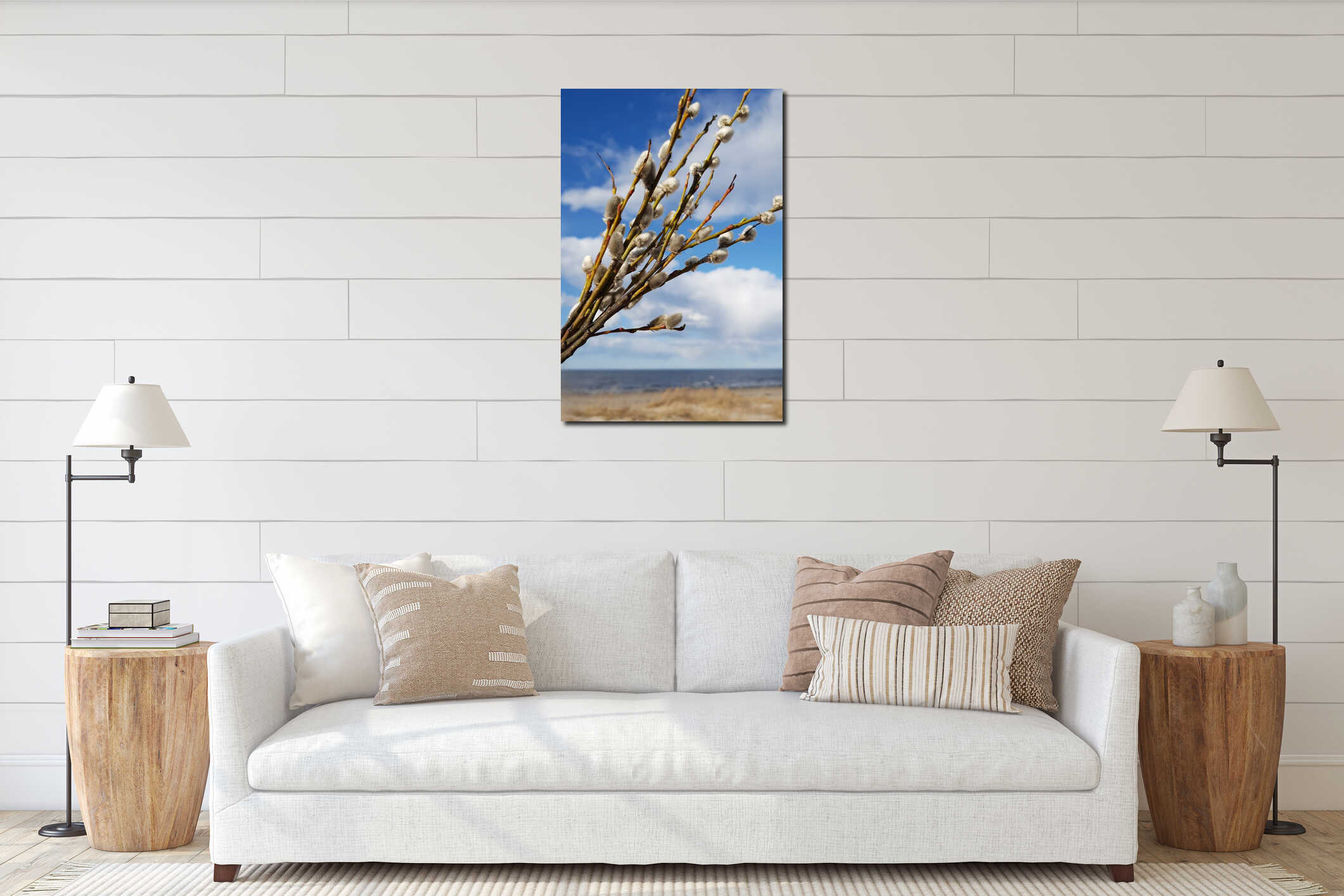 Willow branches are seen against a blue sky filled with clouds. interior mockup