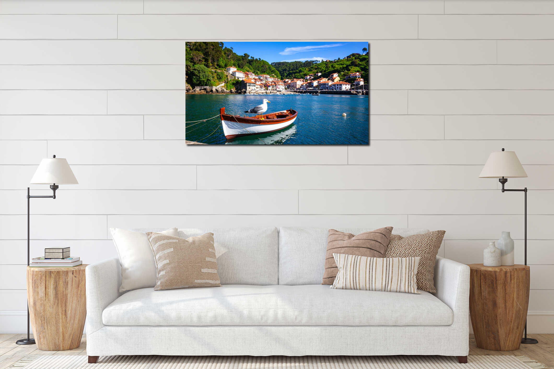 Seagull perched on a small boat in a picturesque coastal village harbor on a sunny day interior mockup