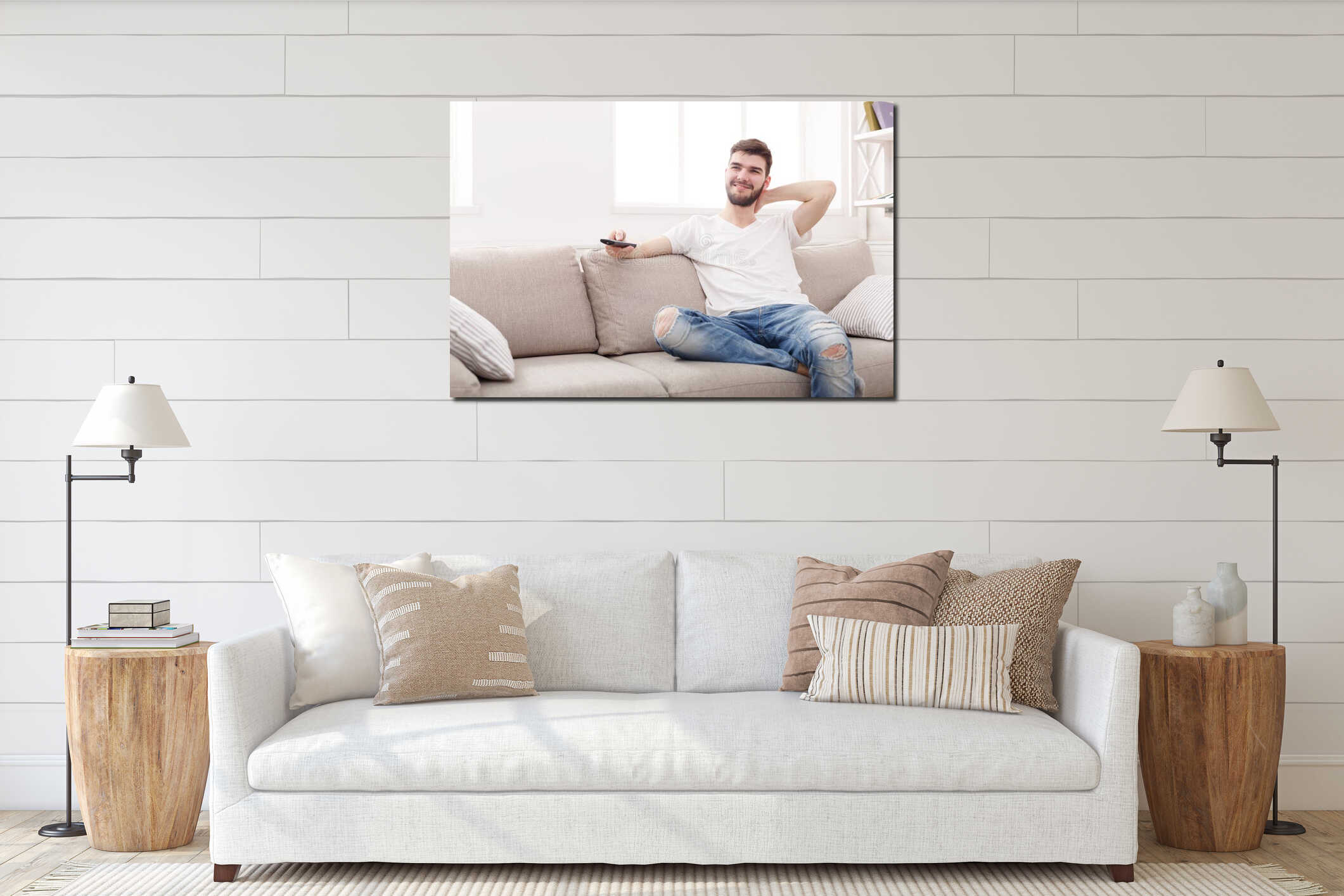 Young Man Relaxes on Sofa While Watching Television in a Bright Living Room Setting interior mockup