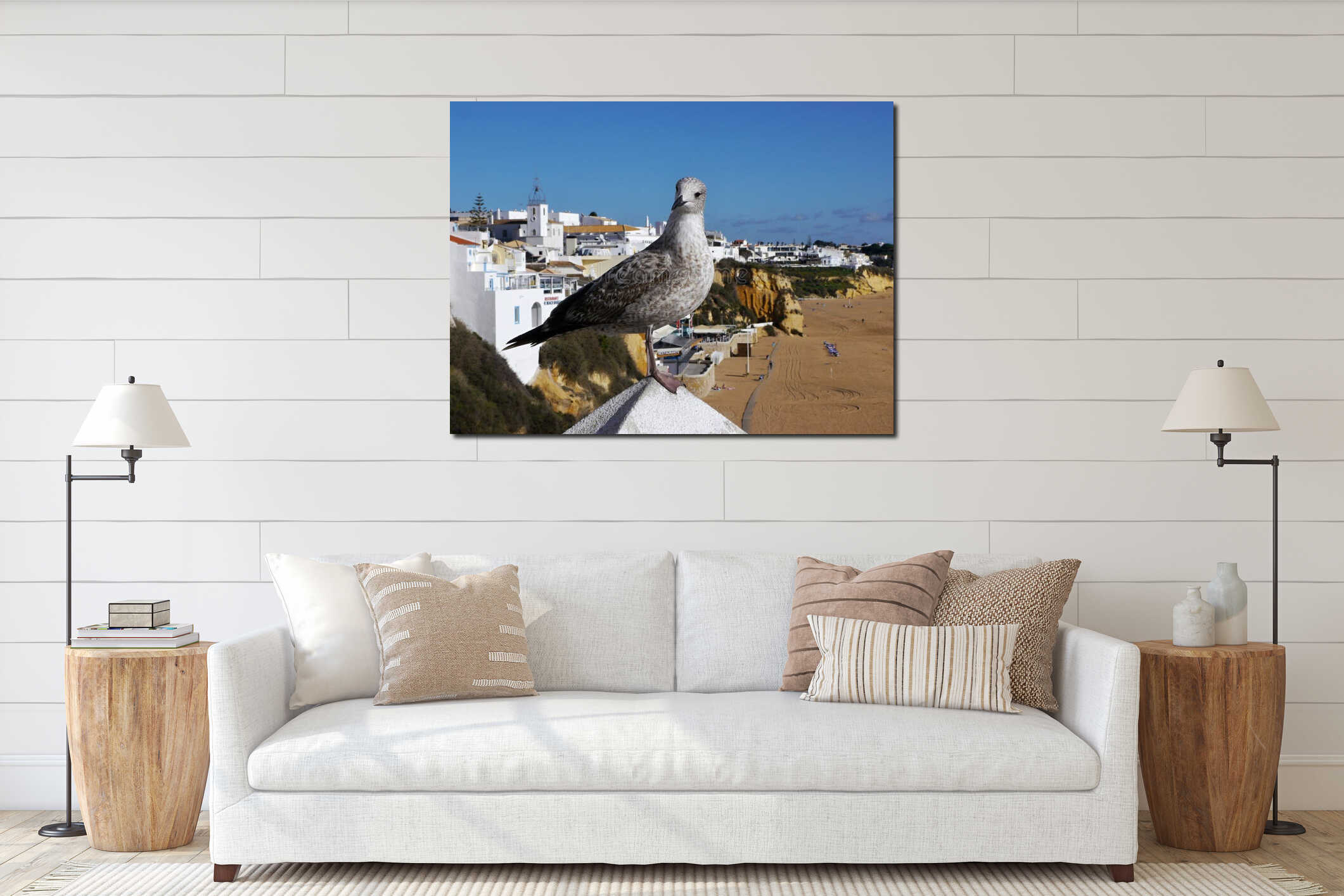 Seagull standing on wall overlooking Albufeira beach interior mockup