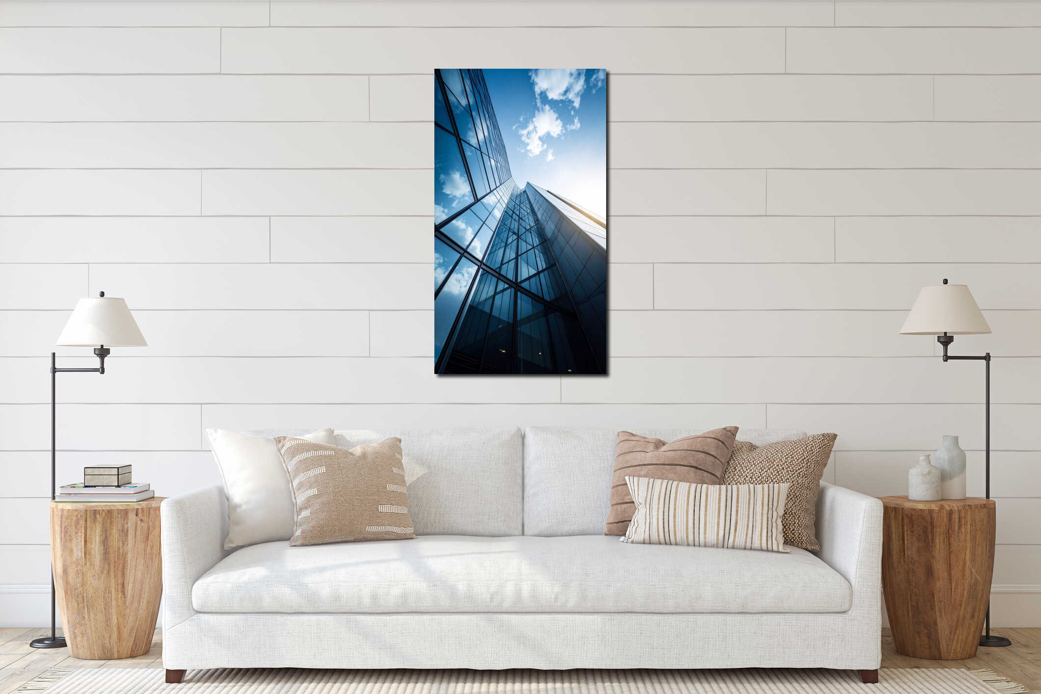 Modern skyscraper exterior with glass facade reflecting blue sky and clouds on a sunny day interior mockup