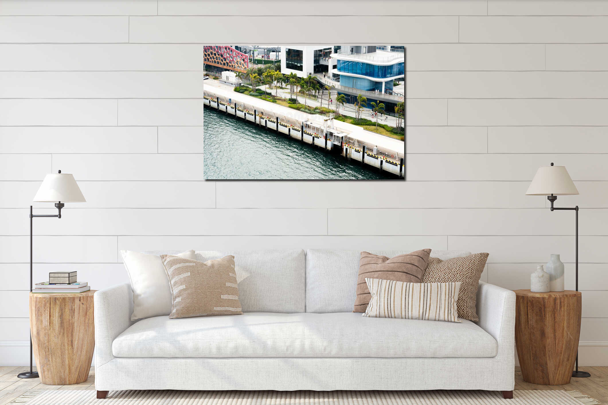 Modern waterfront pier with glass buildings, palm trees, and pedestrian walkway in urban coastal city interior mockup