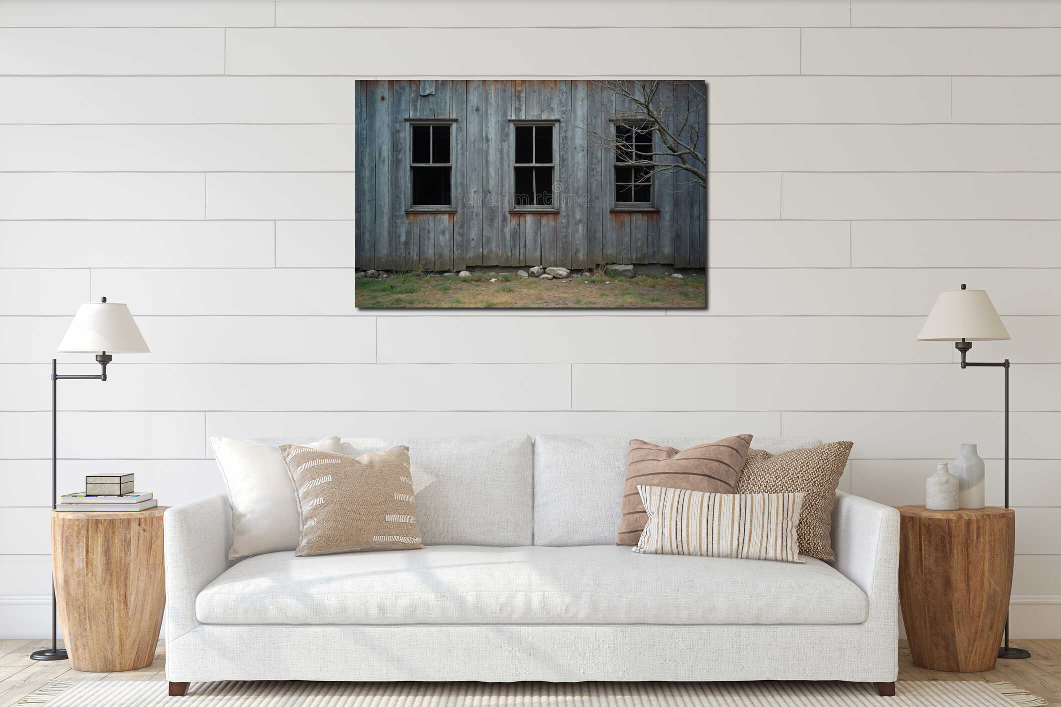Weathered wood barn wall shows three empty window frames. Old rustic building exterior has textured grey timber planks. Bare tree interior mockup
