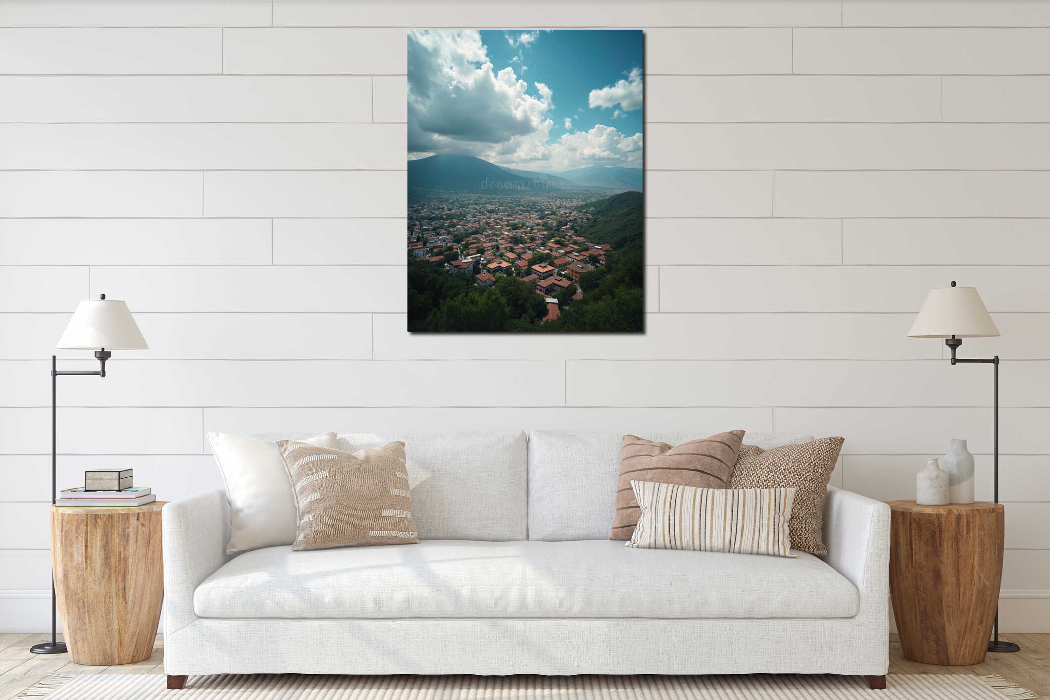 Aerial panorama shows dense city sprawl with red tile roofs nestled among green hills. Distant mountains form a hazy backdrop interior mockup