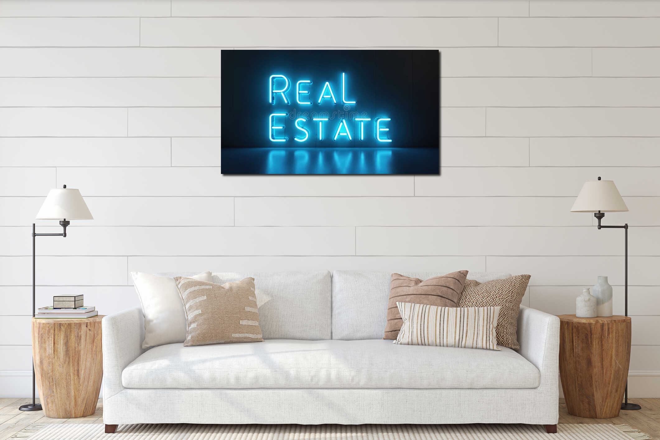 Bright blue neon lettering spells REAL ESTATE on dark wall. Modern sign reflects on glossy floor. Commercial property business interior mockup