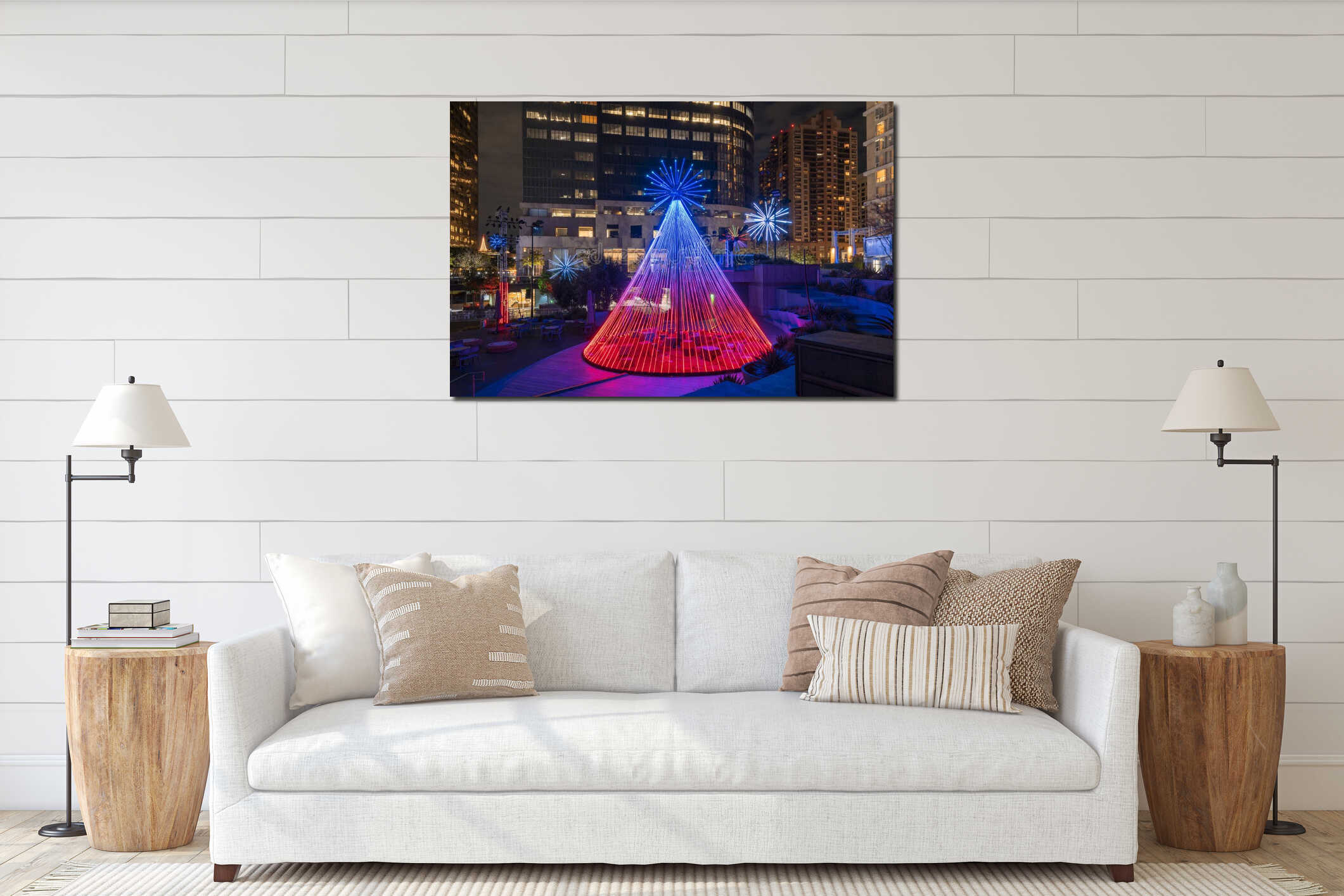 Christmas tree glows in the night sky surrounded by buildings interior mockup