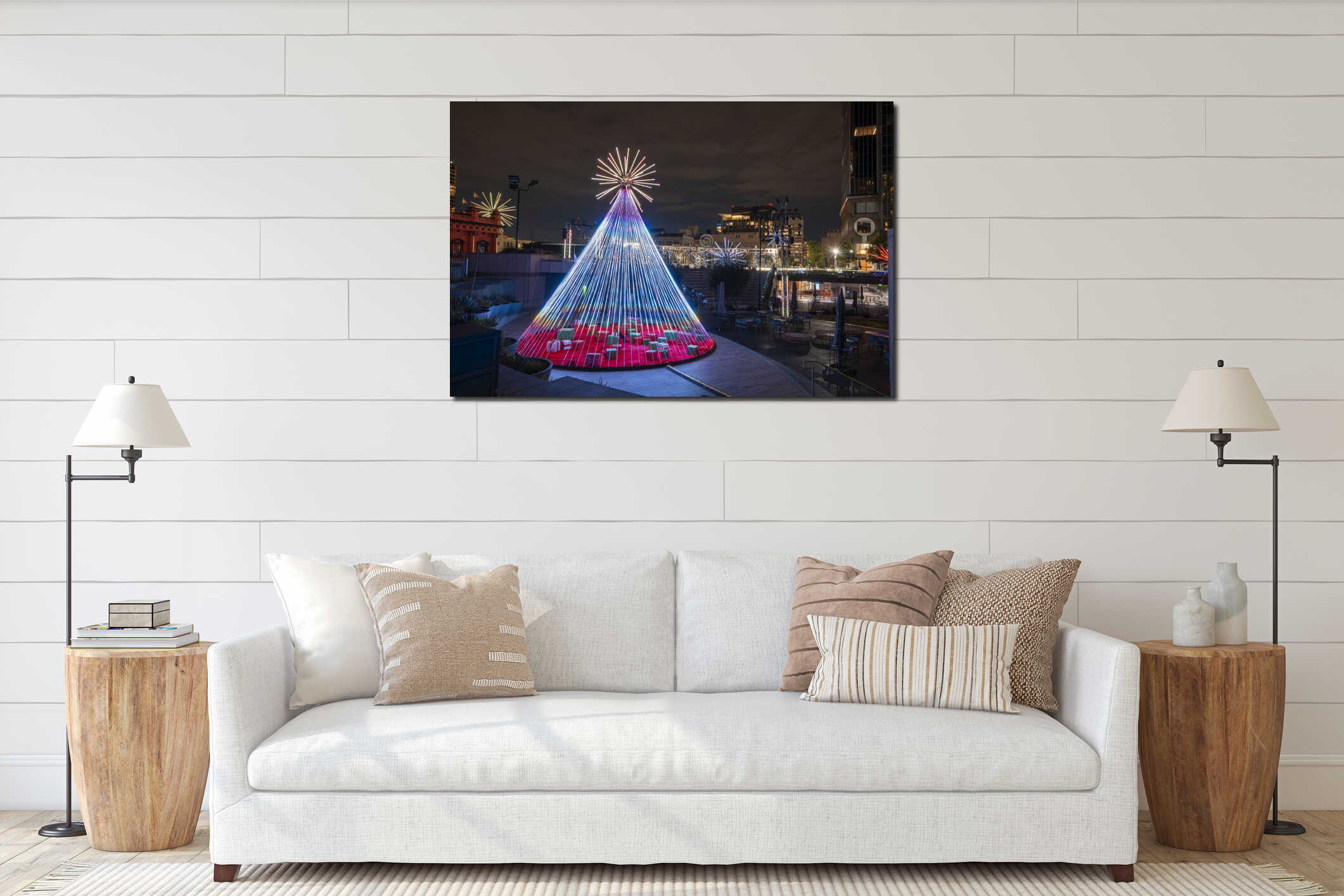 Christmas tree glows in the night sky surrounded by buildings interior mockup