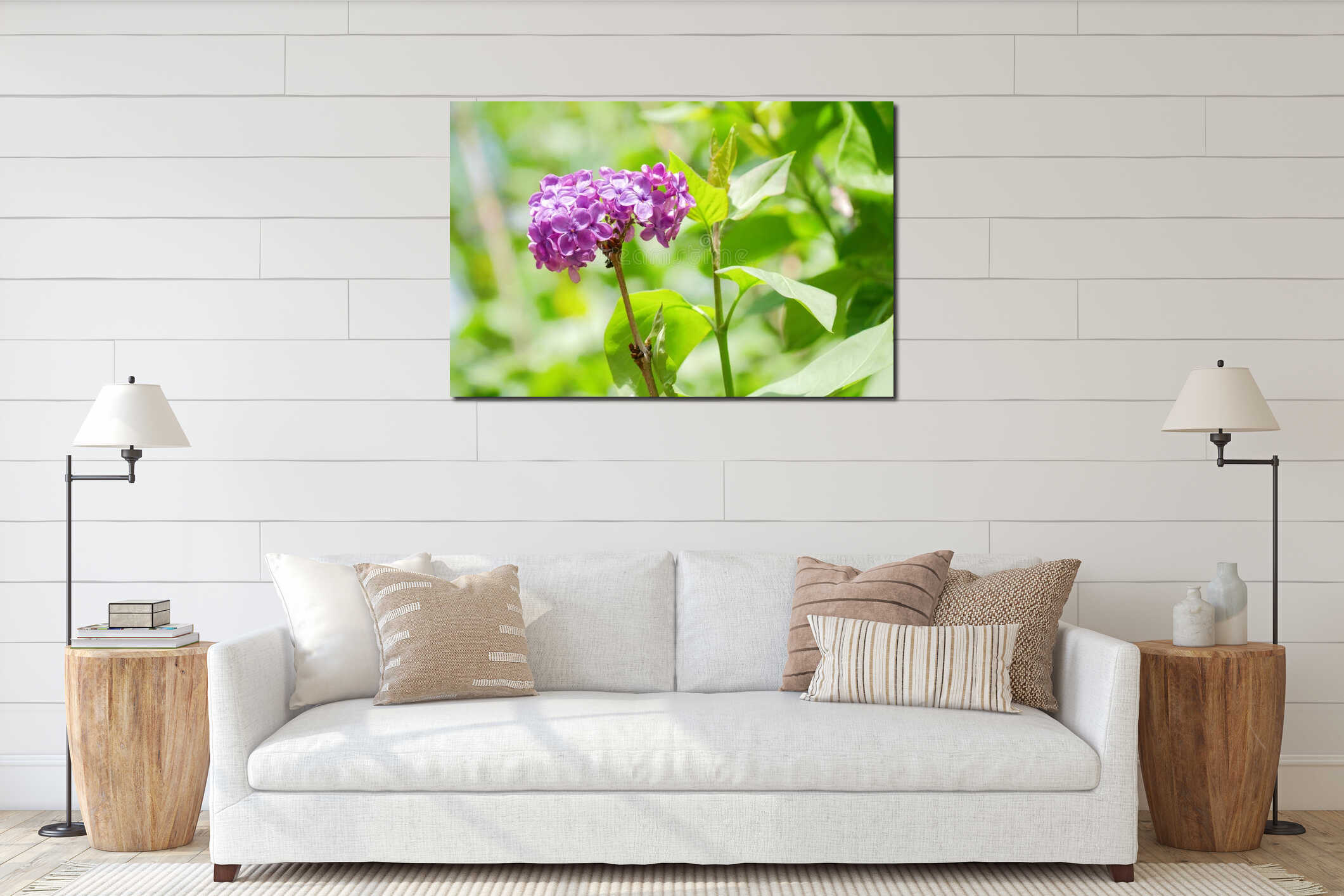 Fresh purple lilac blossoms on branch with green leaves in bright spring sunlight. interior mockup