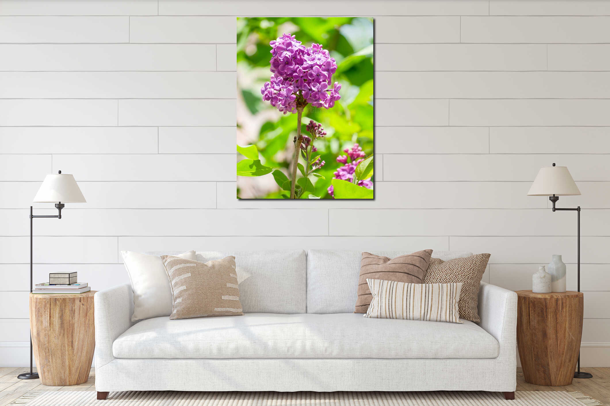 Fresh purple lilac blossoms on branch with green leaves in bright spring sunlight. interior mockup