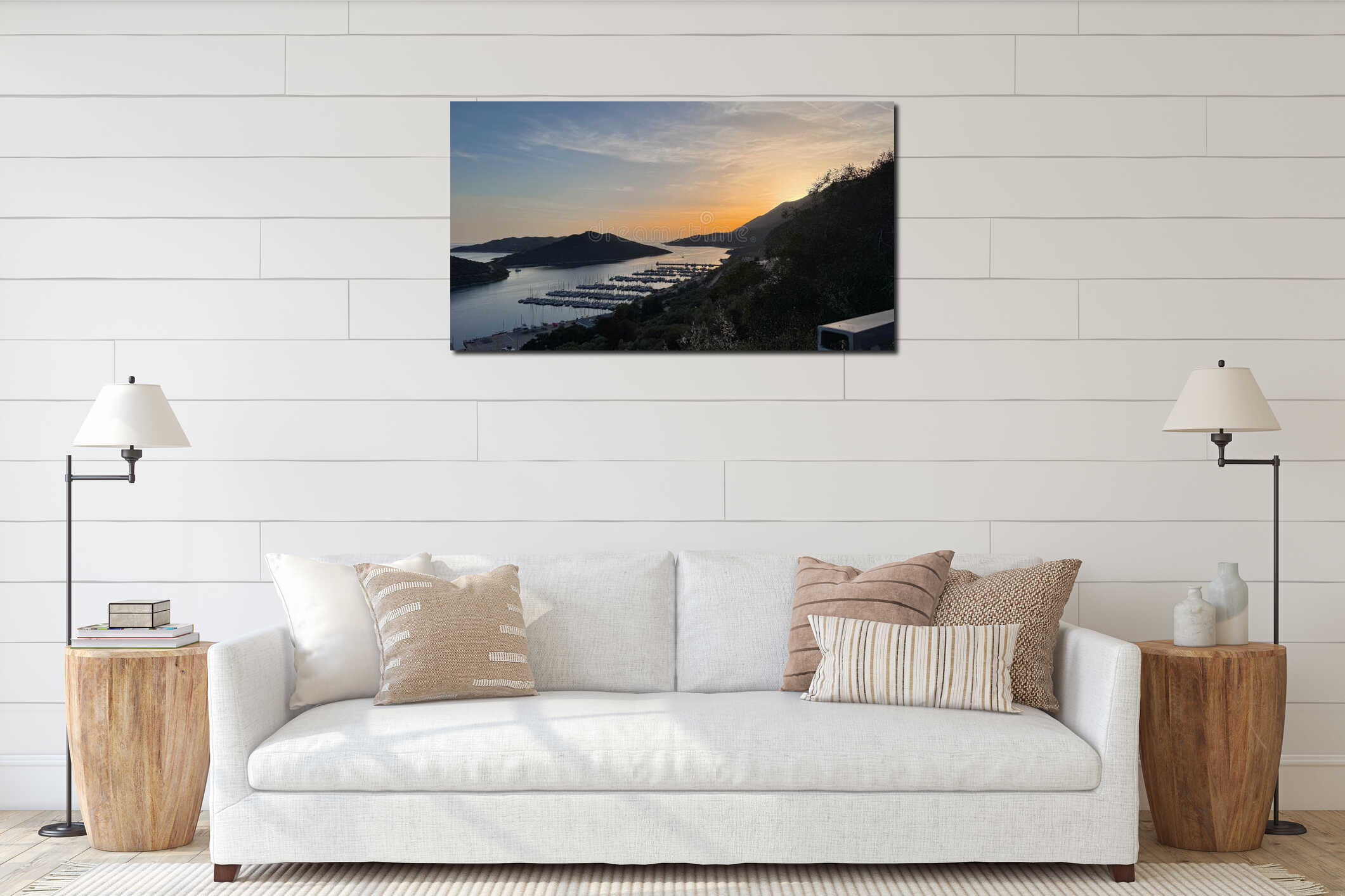 Summer evening sunset seascape over a bay near Kas, Turkiye, with yachts and ships in the harbor. The sun sets behind the interior mockup