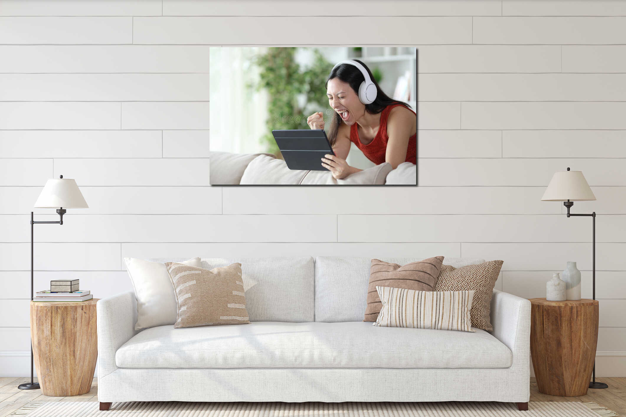 Excited asian woman watchig media on tablet celebrating interior mockup