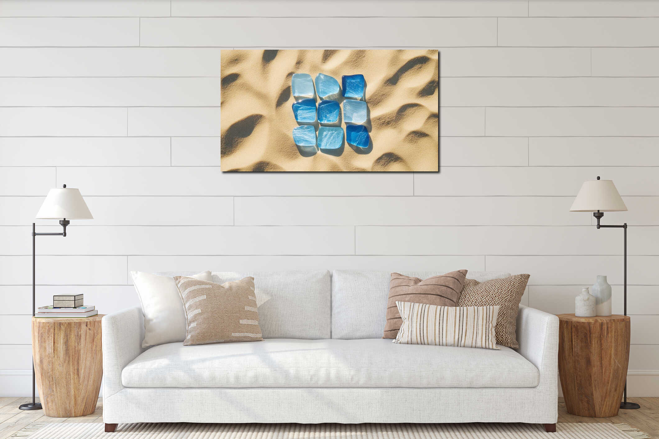 A Collection of Blue Sea Glass Pieces Sparkling Under the Sun on a Sandy Beach Shoreline interior mockup